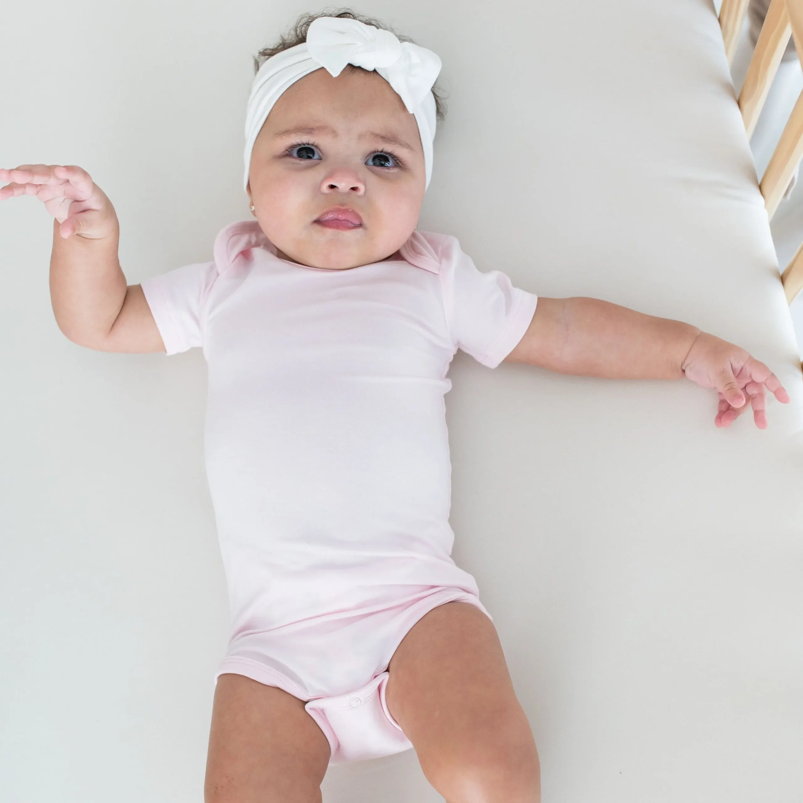 Kyte Baby Bodysuit in Sakura