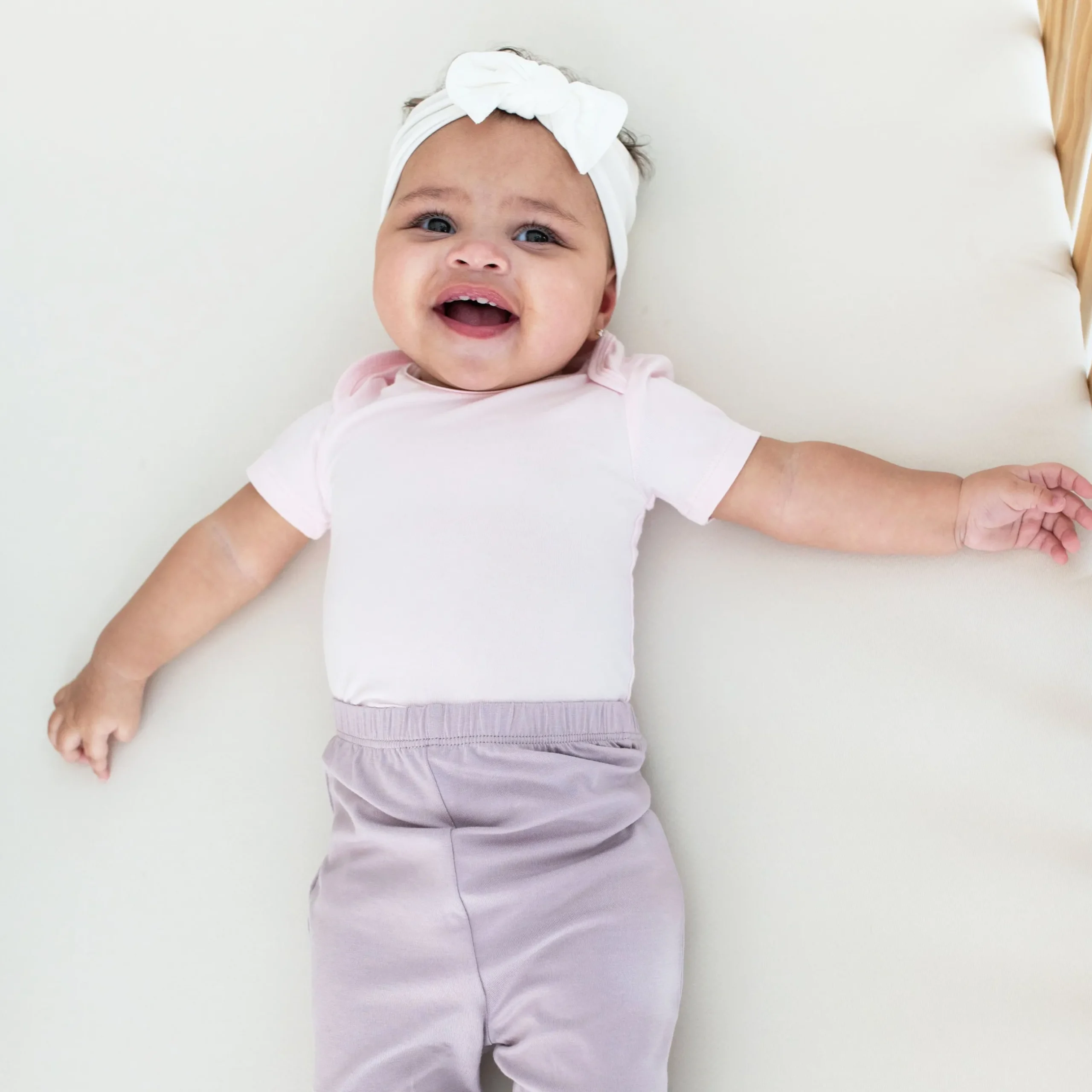 Kyte Baby Bodysuit in Sakura