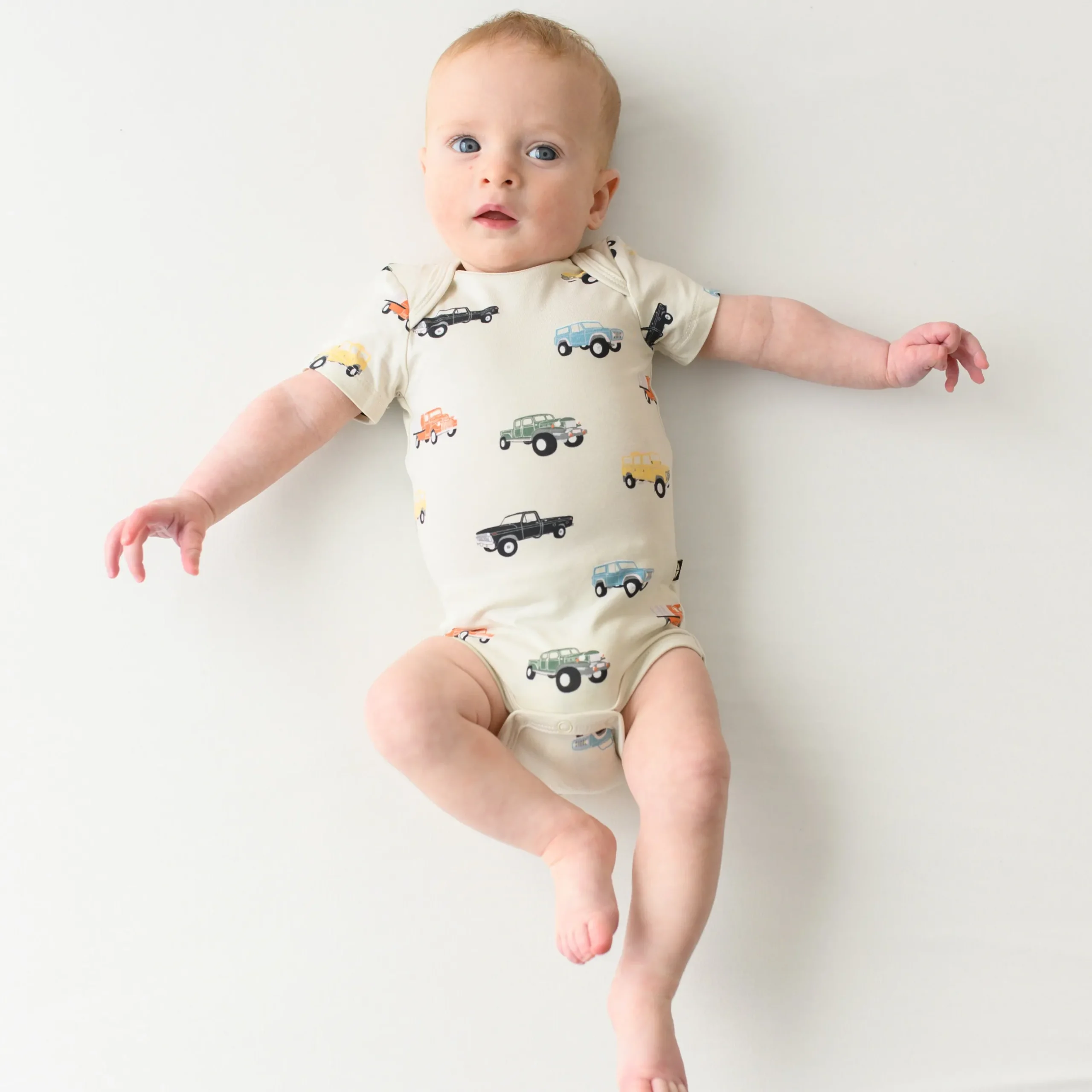 Sale Kyte Baby Bodysuit in Vintage Truck