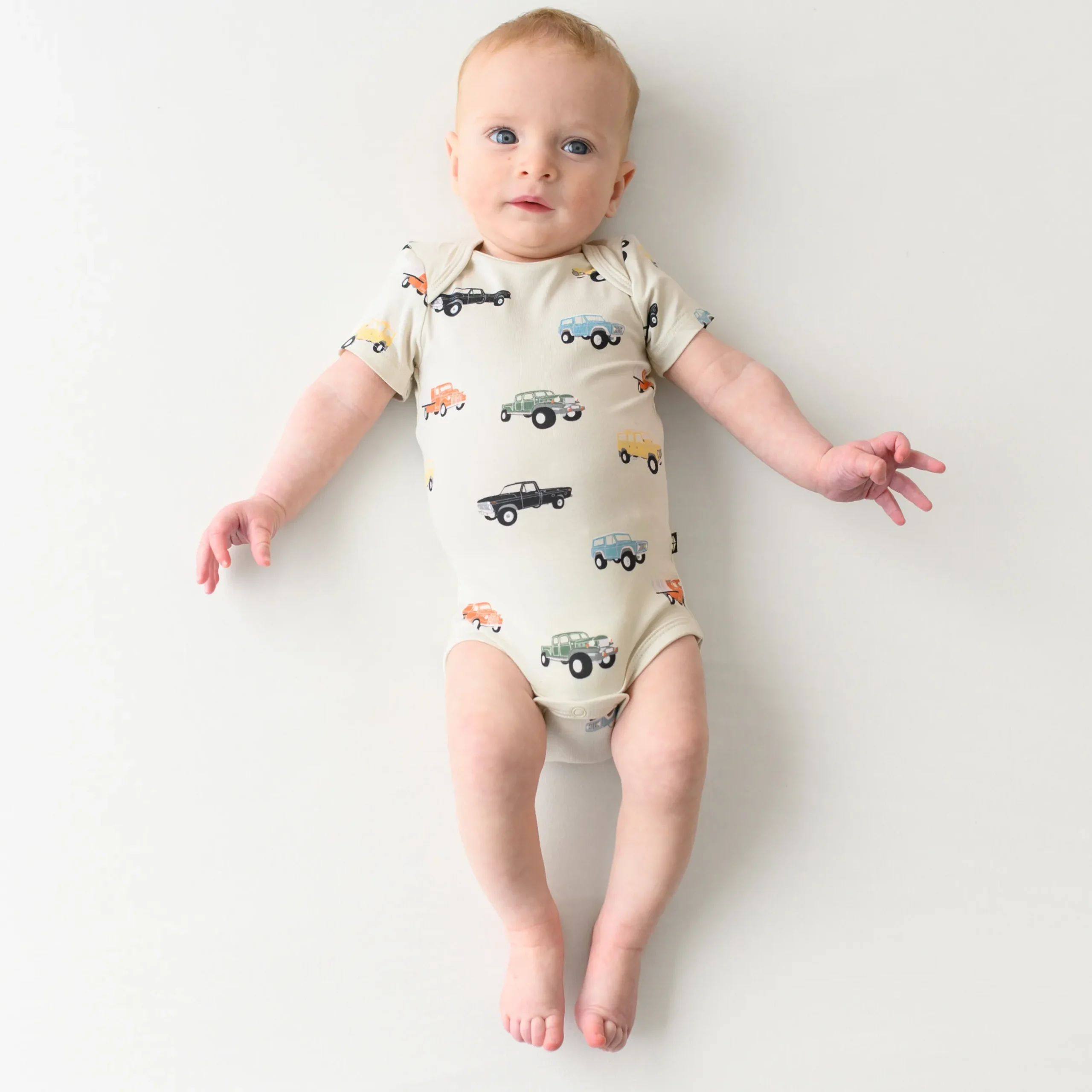 Sale Kyte Baby Bodysuit in Vintage Truck