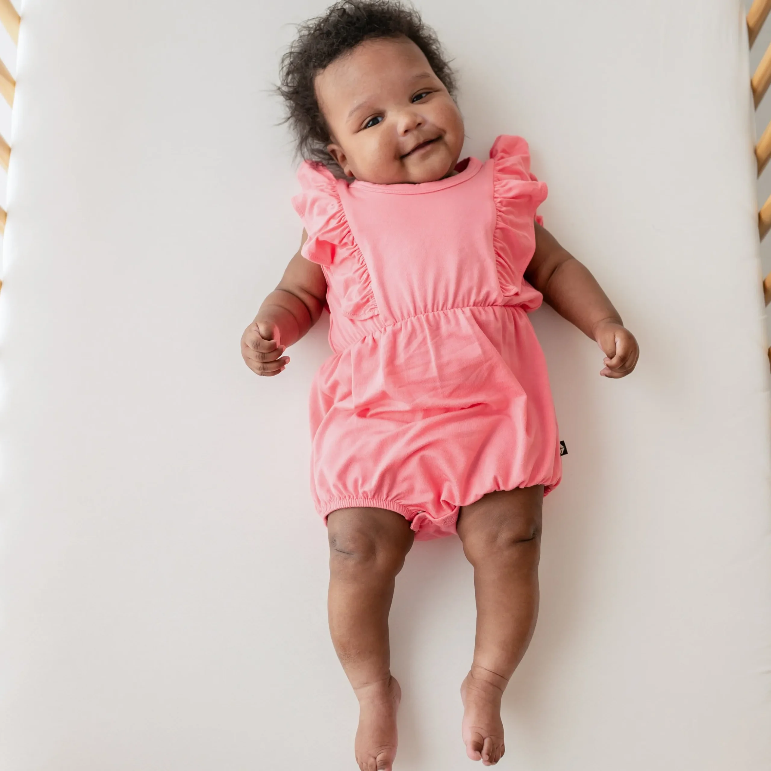 Online Kyte Baby Bubble Romper in Guava