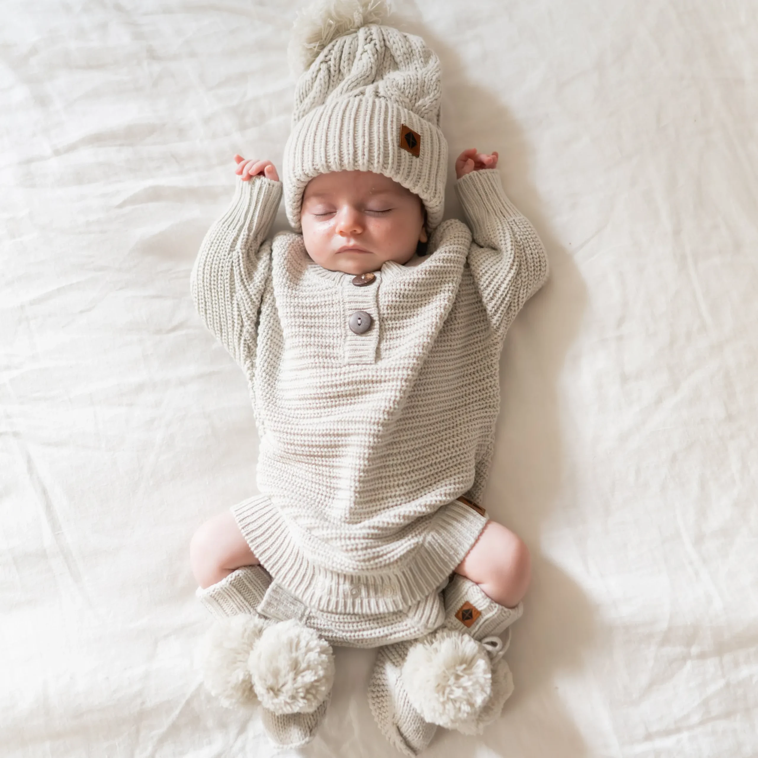 New Kyte Baby Chunky Knit Romper in Oat
