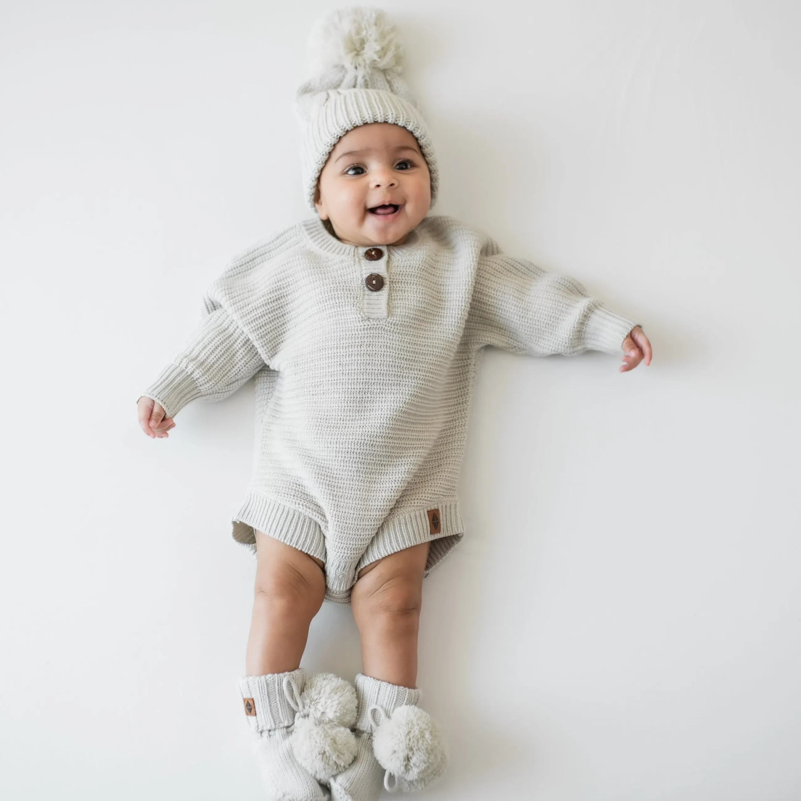New Kyte Baby Chunky Knit Romper in Oat