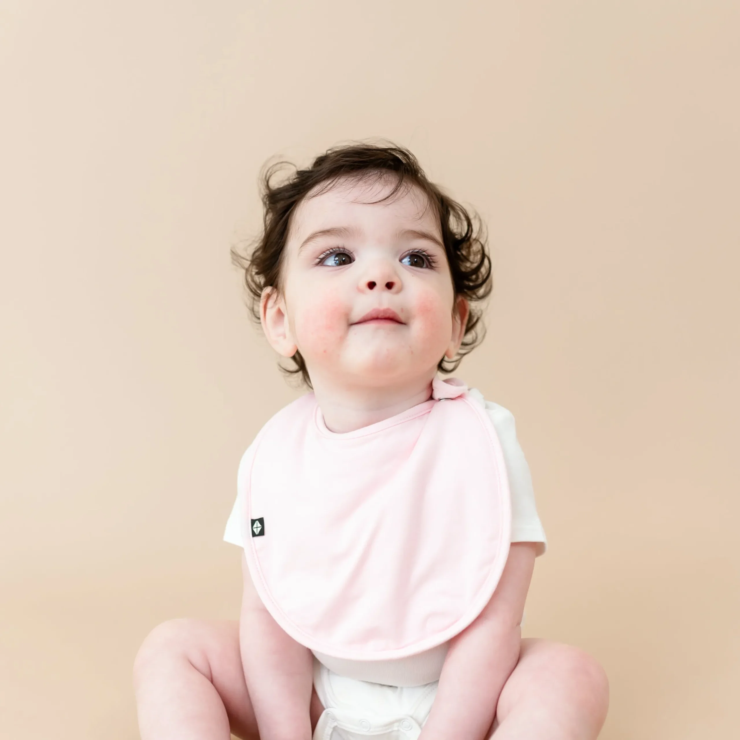 Sale Kyte Baby Cushy Bib in Sakura