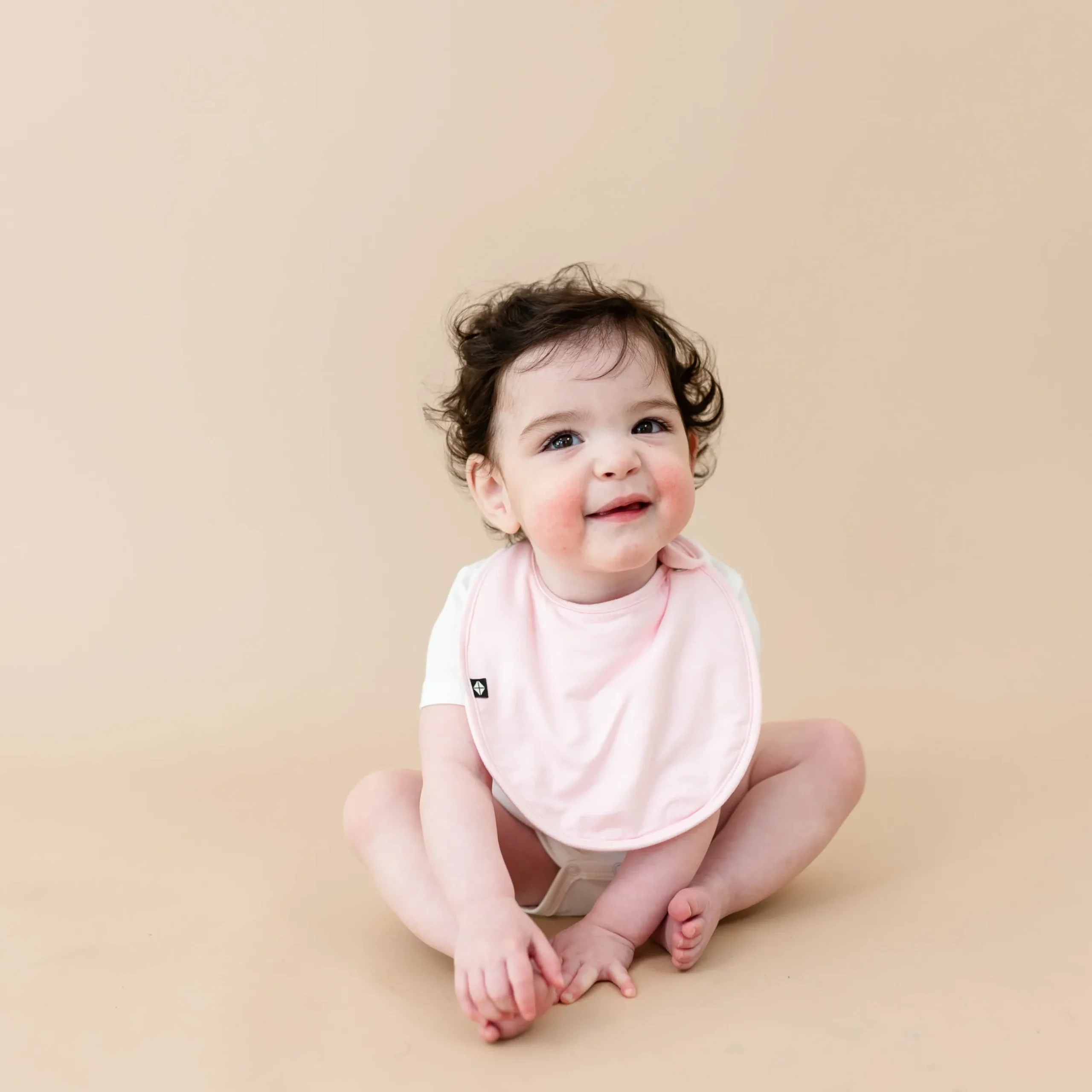Sale Kyte Baby Cushy Bib in Sakura