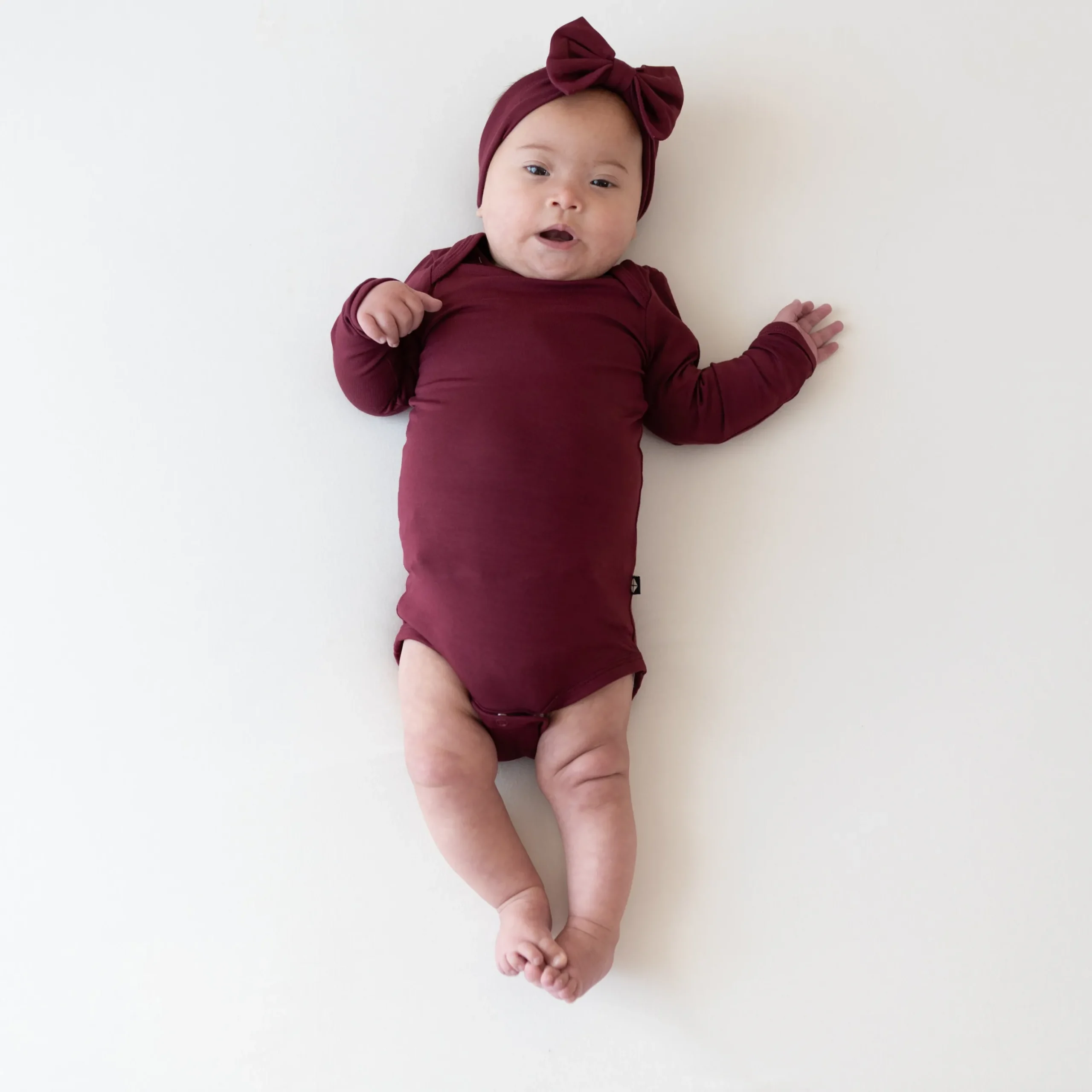 Sale Kyte Baby Long Sleeve Bodysuit in Burgundy