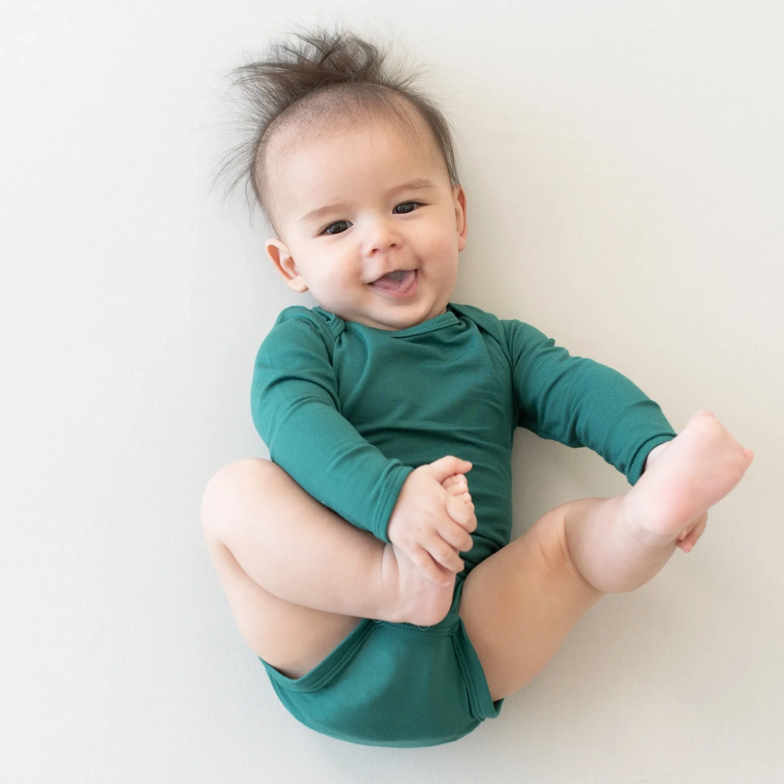 Outlet Kyte Baby Long Sleeve Bodysuit in Emerald