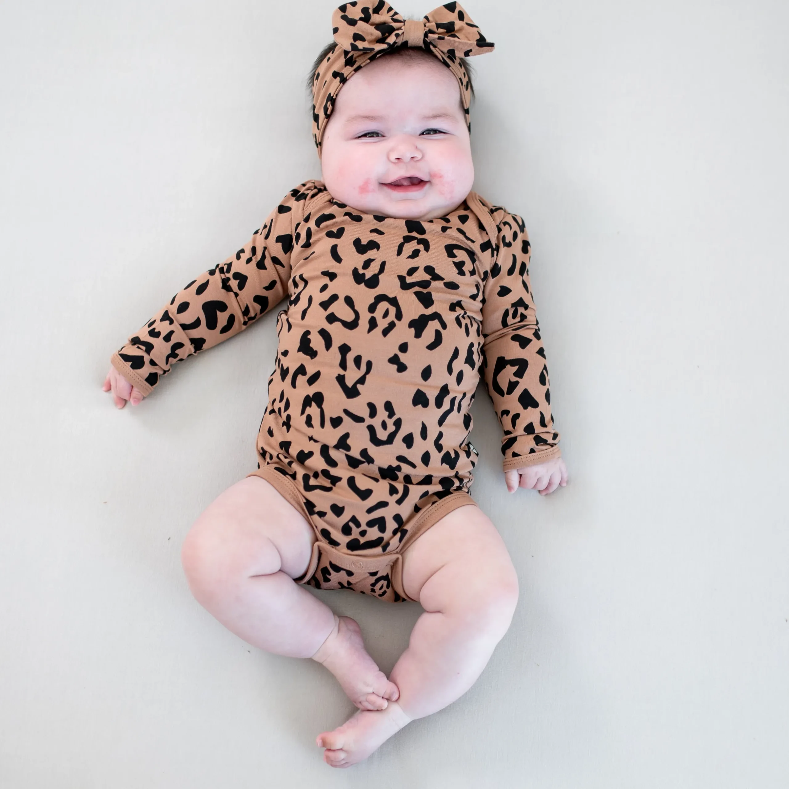 Best Kyte Baby Long Sleeve Bodysuit in Latte Leopard