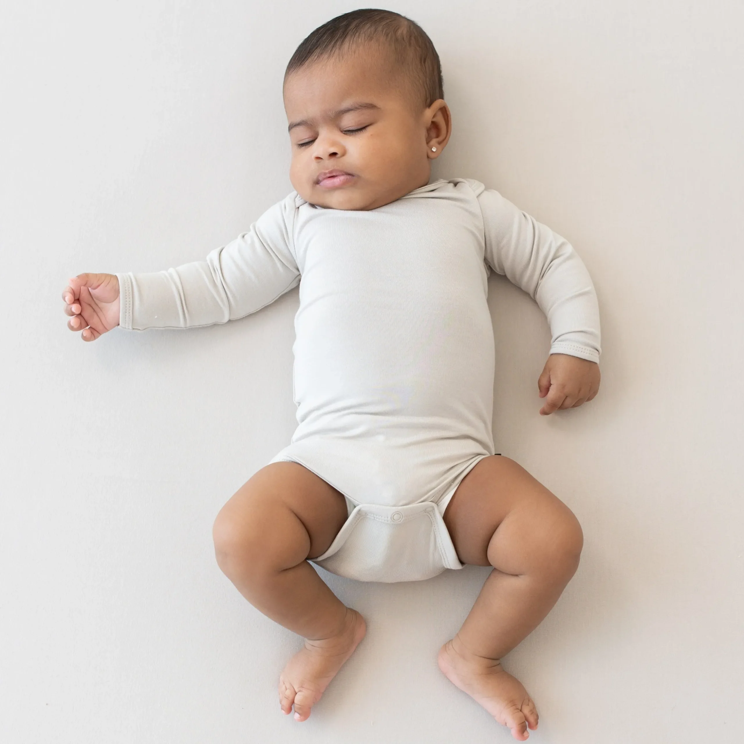 New Kyte Baby Long Sleeve Bodysuit in Oat