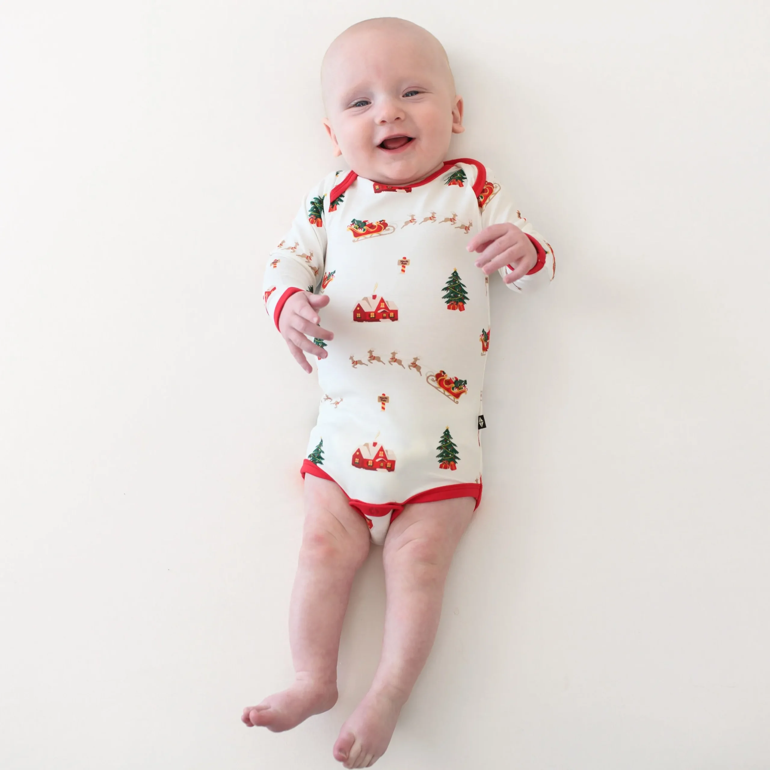 Hot Kyte Baby Long Sleeve Bodysuit in Santa Sleigh
