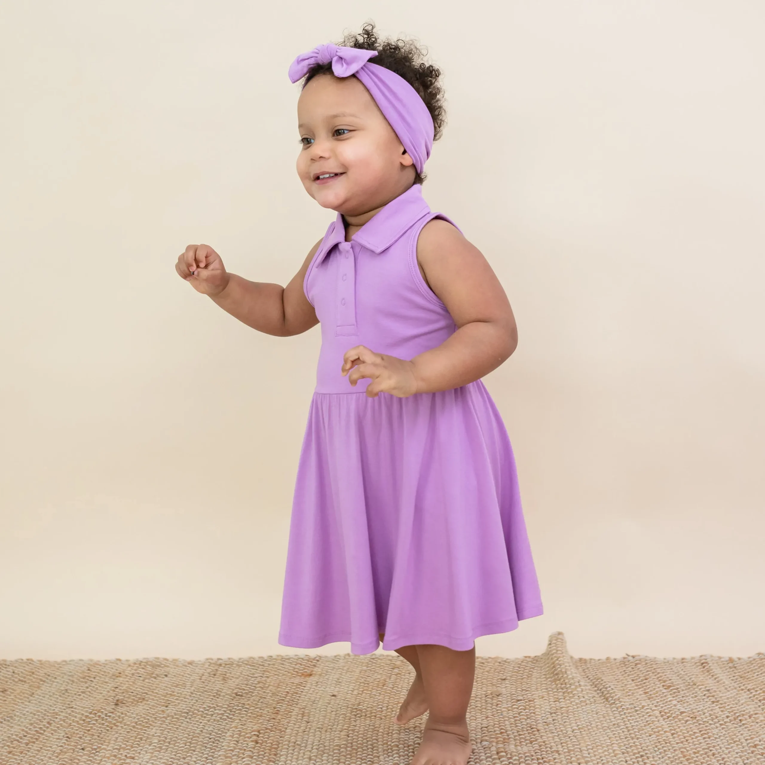 Kyte Baby Polo Bodysuit Dress in Poi