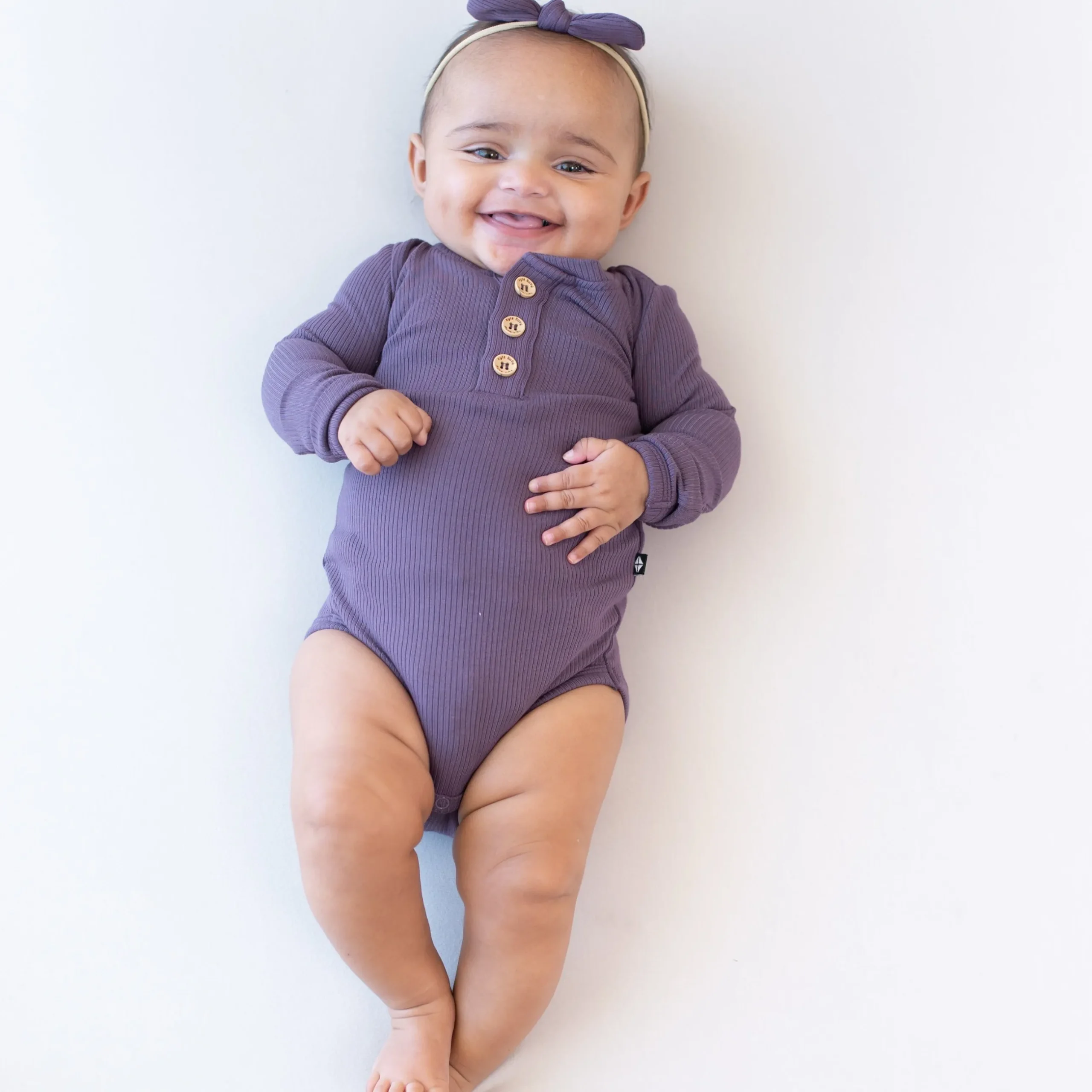 New Kyte Baby Ribbed Long Sleeve Henley Bodysuit in Currant