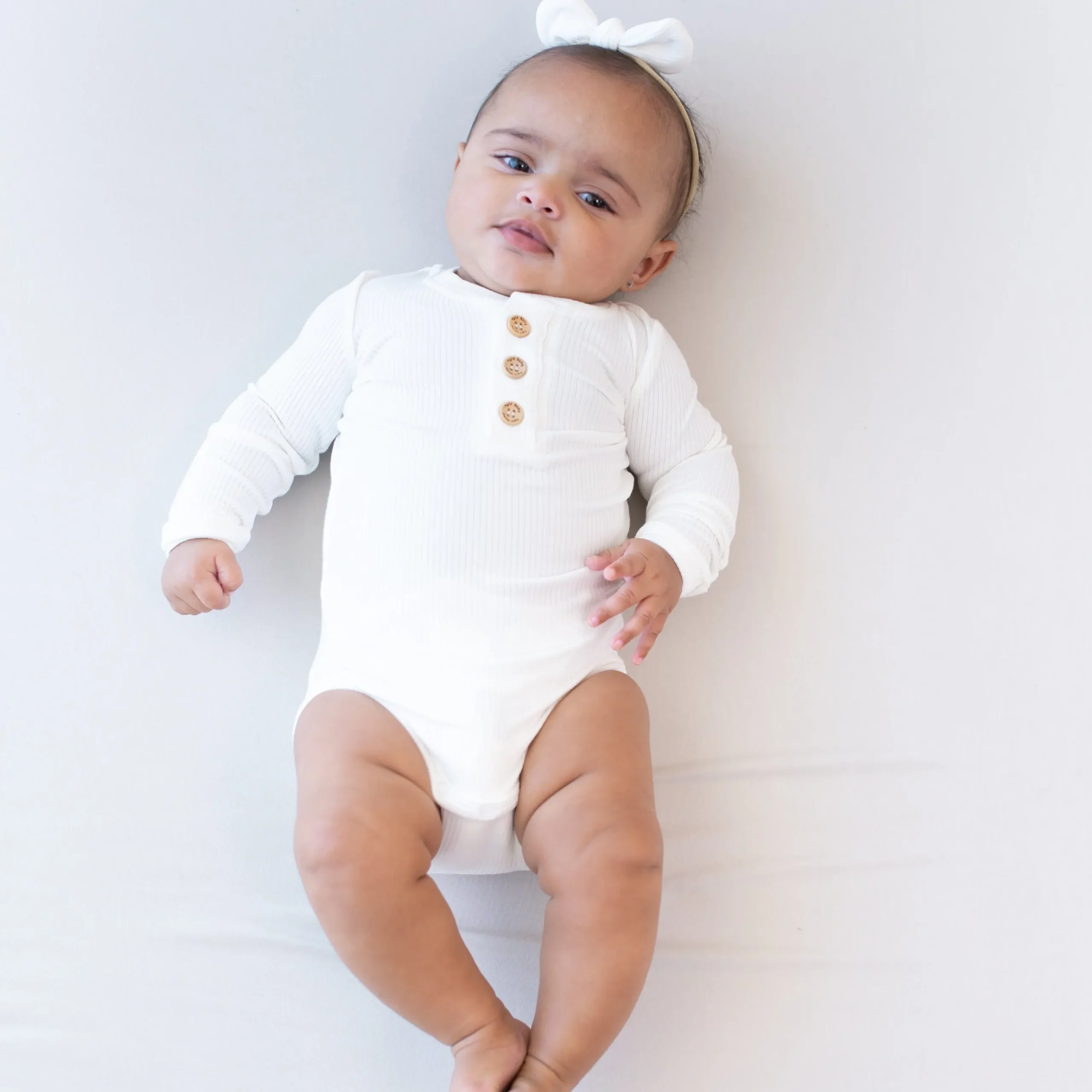 Clearance Kyte Baby Ribbed Long Sleeve Henley Bodysuit in Cloud