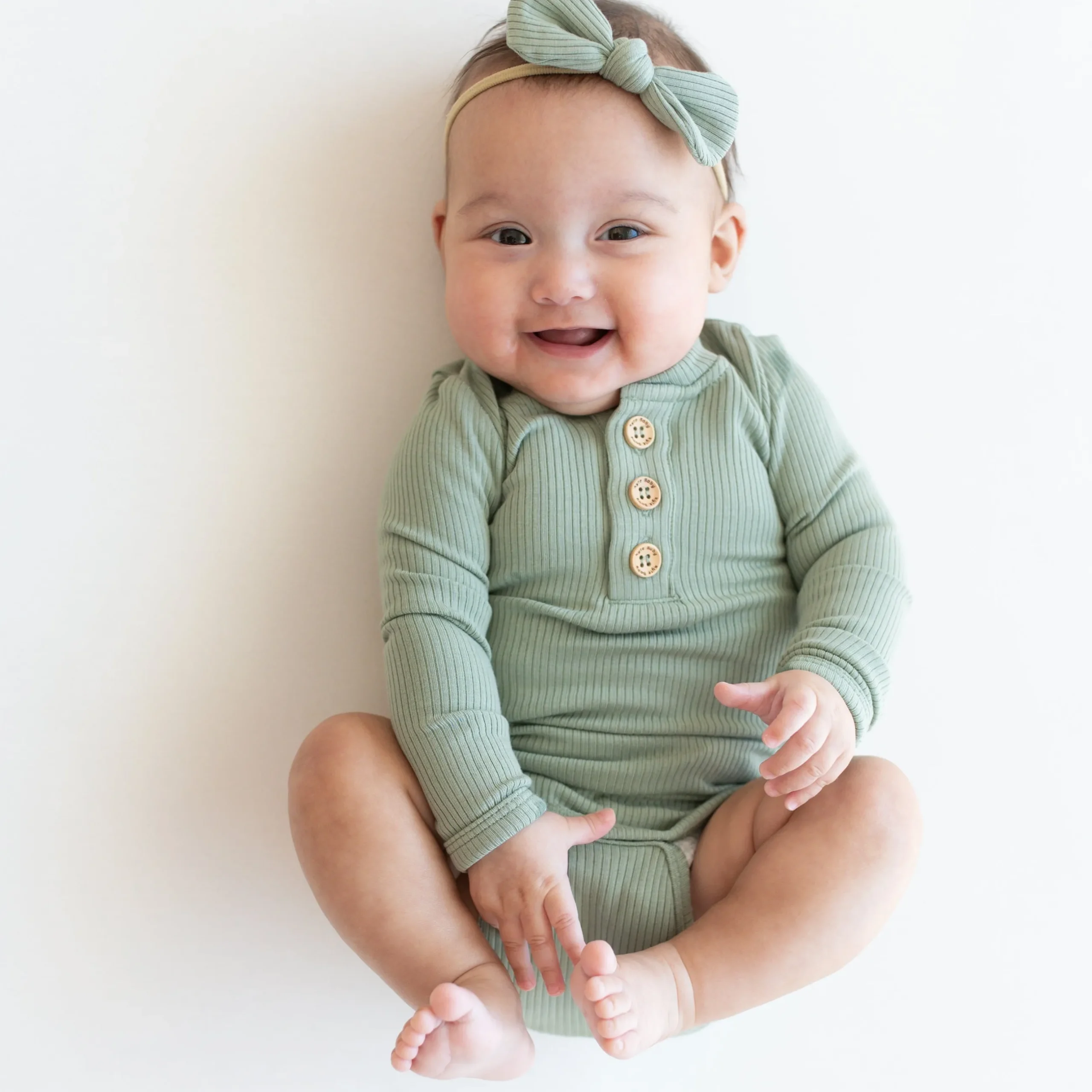 Kyte Baby Ribbed Long Sleeve Henley Bodysuit in Thyme
