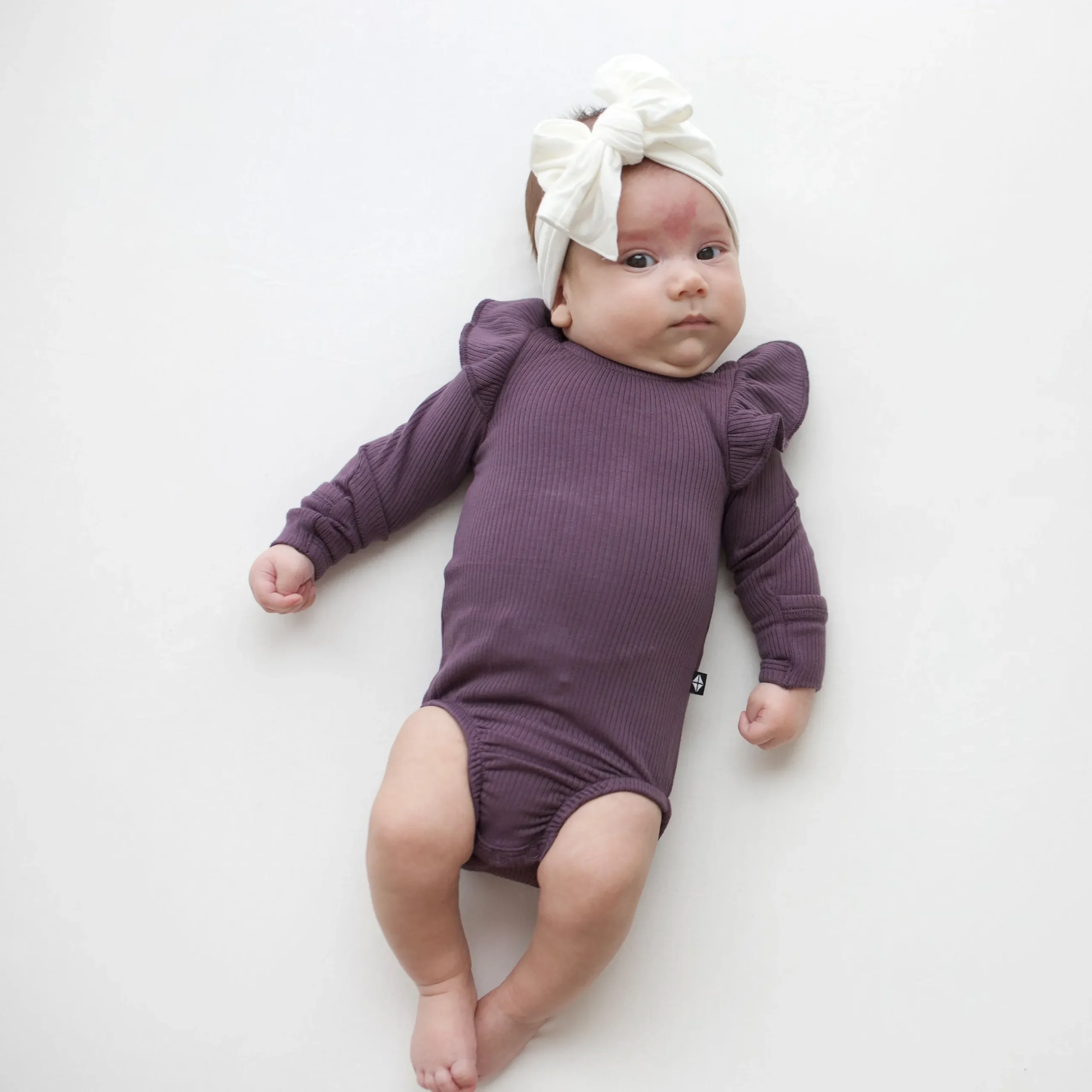 Hot Kyte Baby Ribbed Long Sleeve Ruffle Leotard in Currant