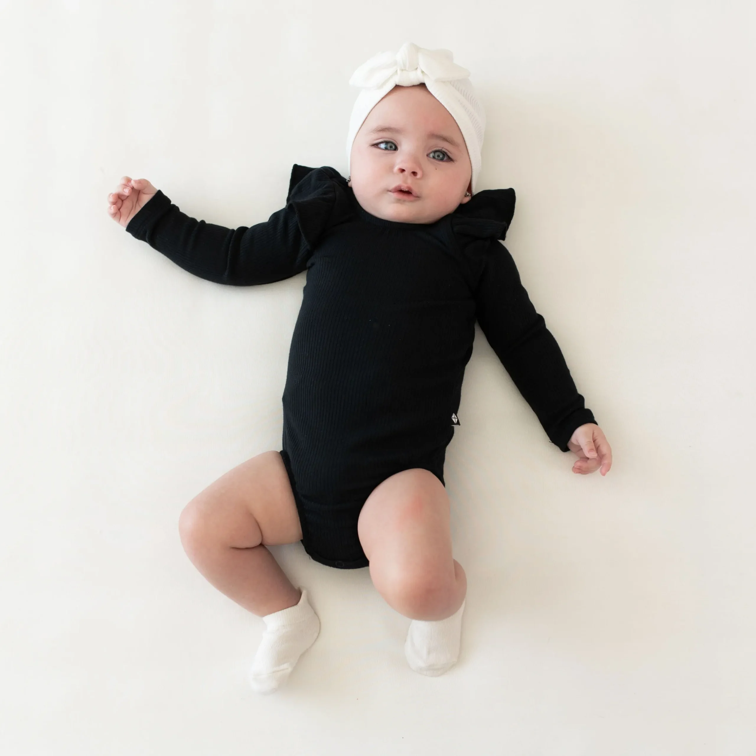 Kyte Baby Ribbed Long Sleeve Ruffle Leotard in Midnight