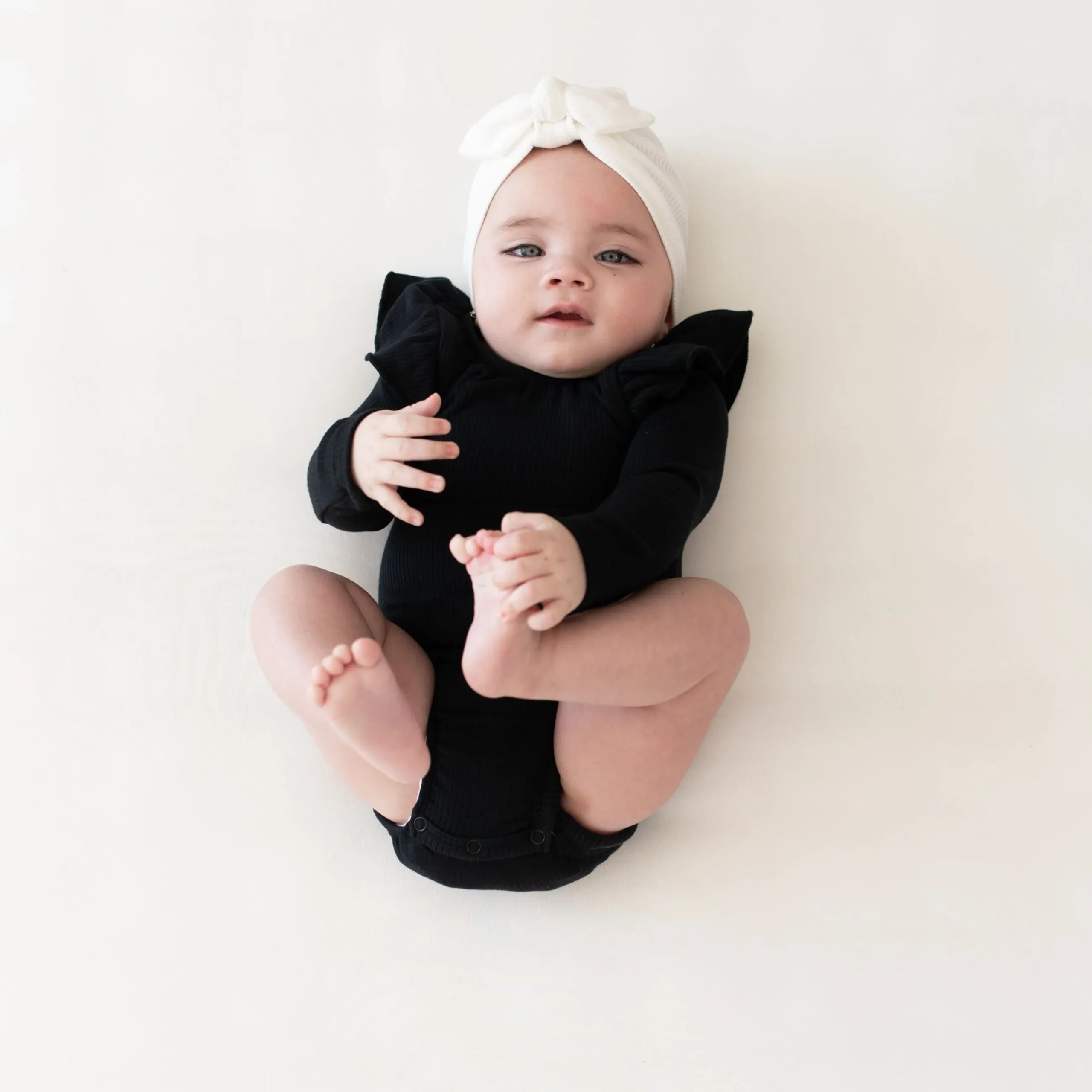 Kyte Baby Ribbed Long Sleeve Ruffle Leotard in Midnight