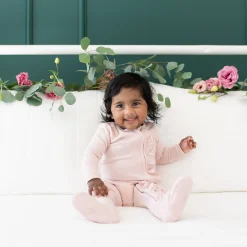 New Kyte Baby Ribbed Ruffle Zipper Footie in Blush