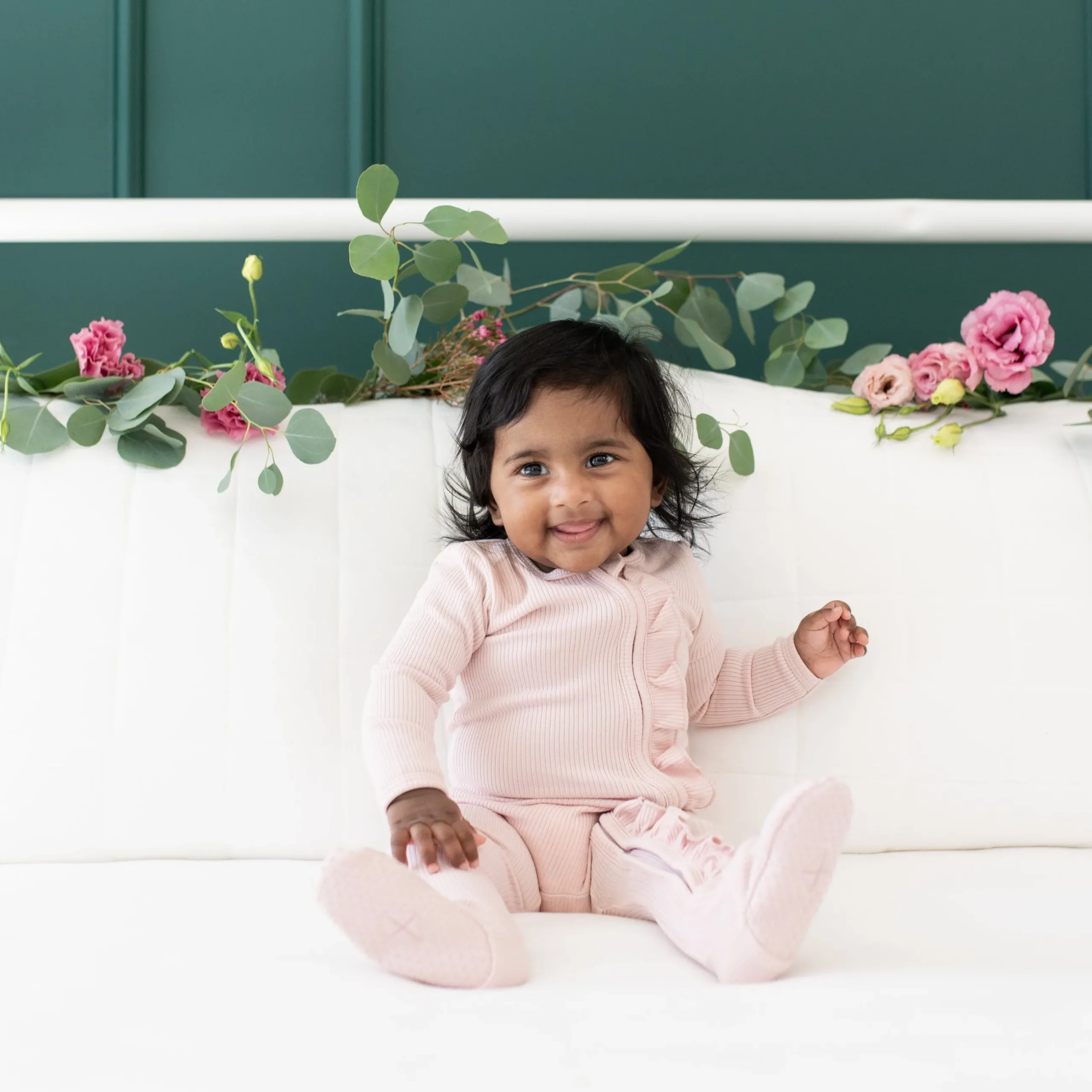 New Kyte Baby Ribbed Ruffle Zipper Footie in Blush
