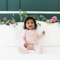 New Kyte Baby Ribbed Ruffle Zipper Footie in Blush