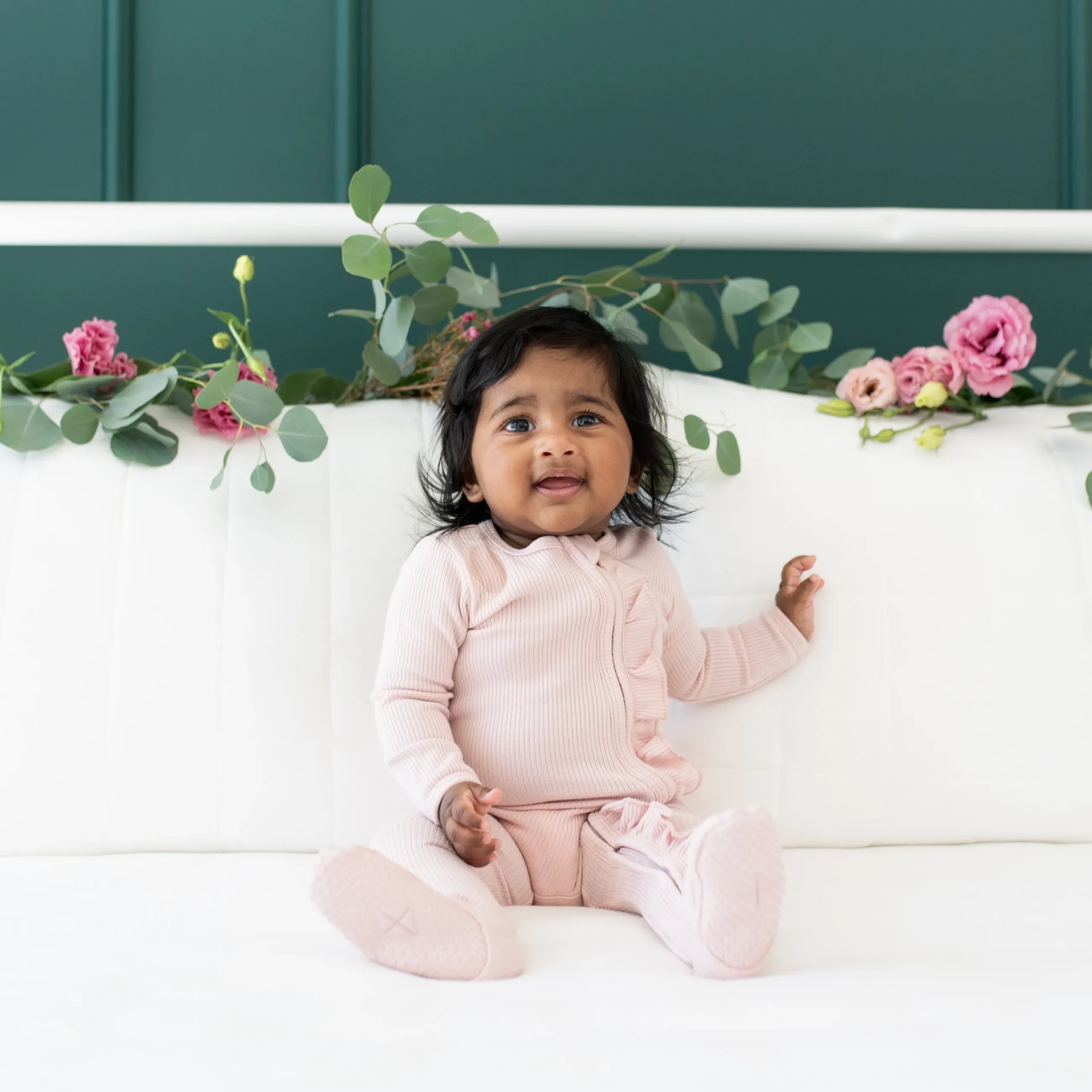New Kyte Baby Ribbed Ruffle Zipper Footie in Blush
