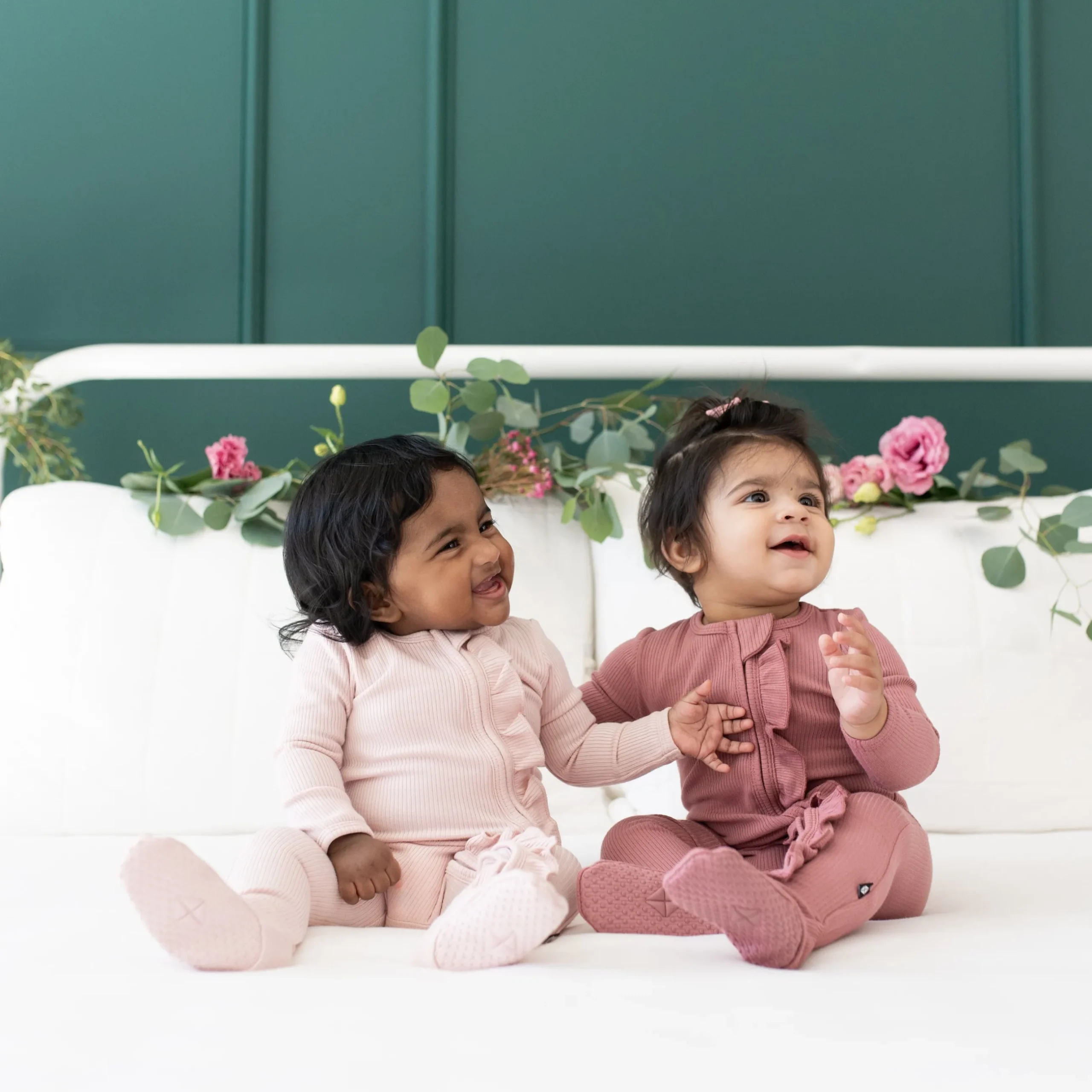 New Kyte Baby Ribbed Ruffle Zipper Footie in Blush
