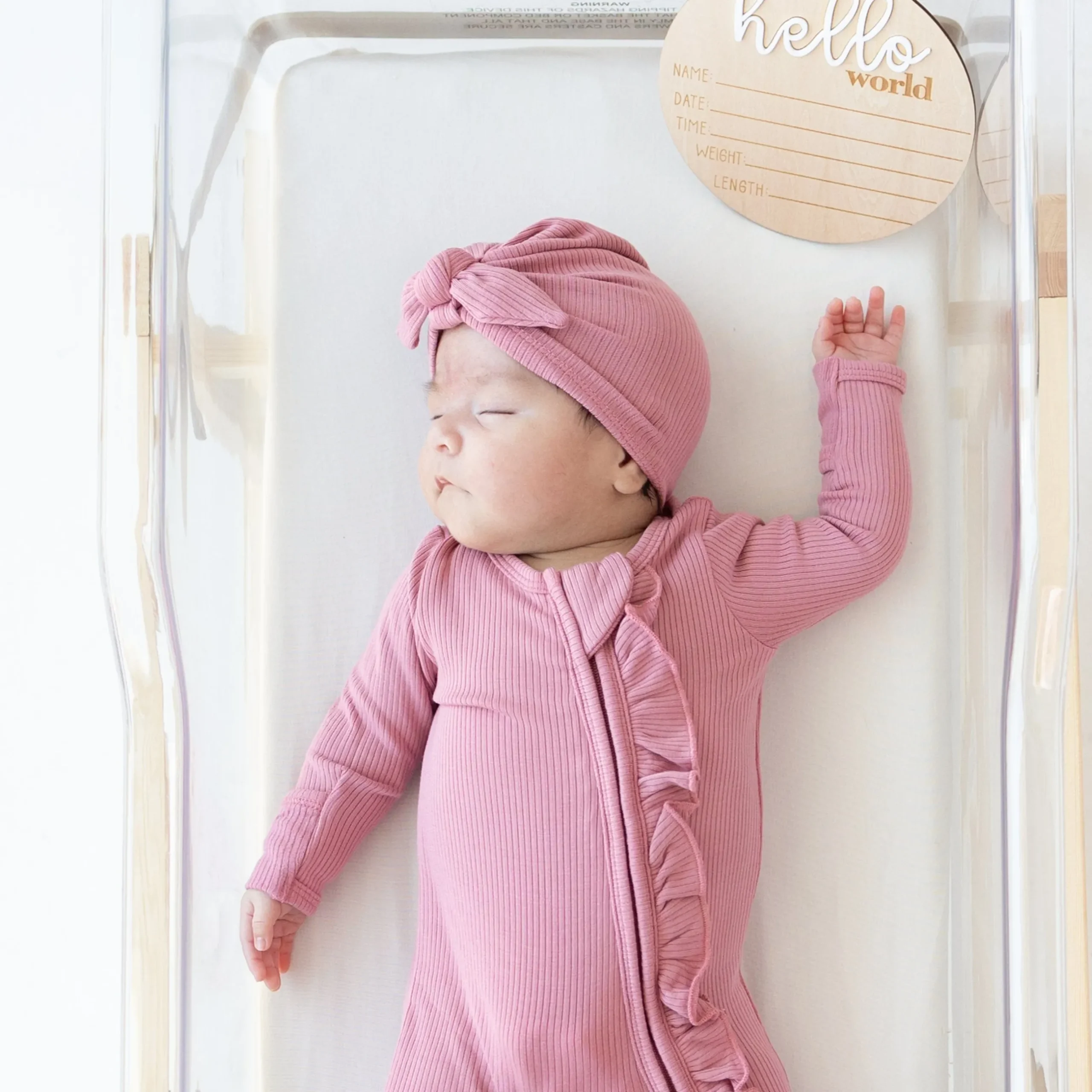 New Kyte Baby Ribbed Ruffle Zipper Footie in Apple Blossom