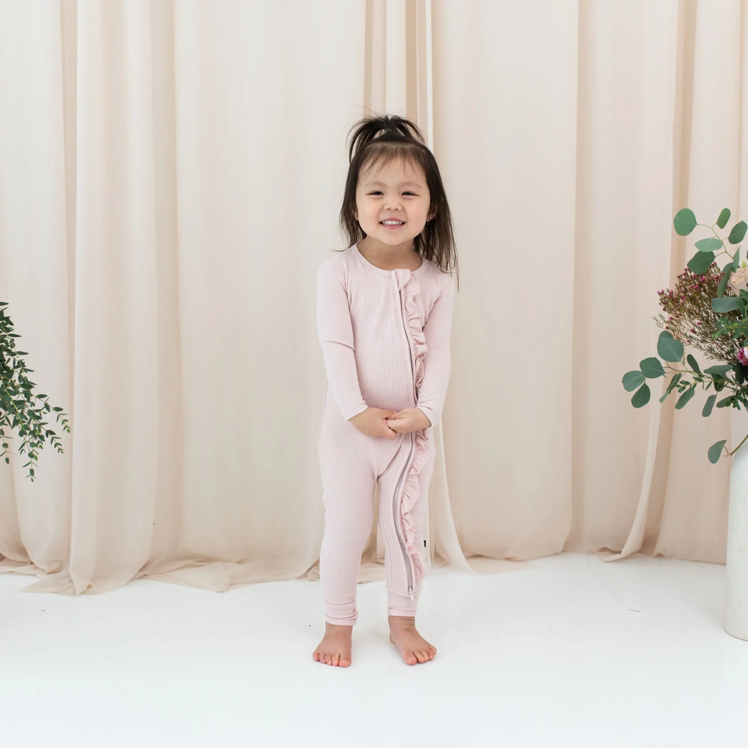Clearance Kyte Baby Ribbed Ruffle Zipper Romper in Blush