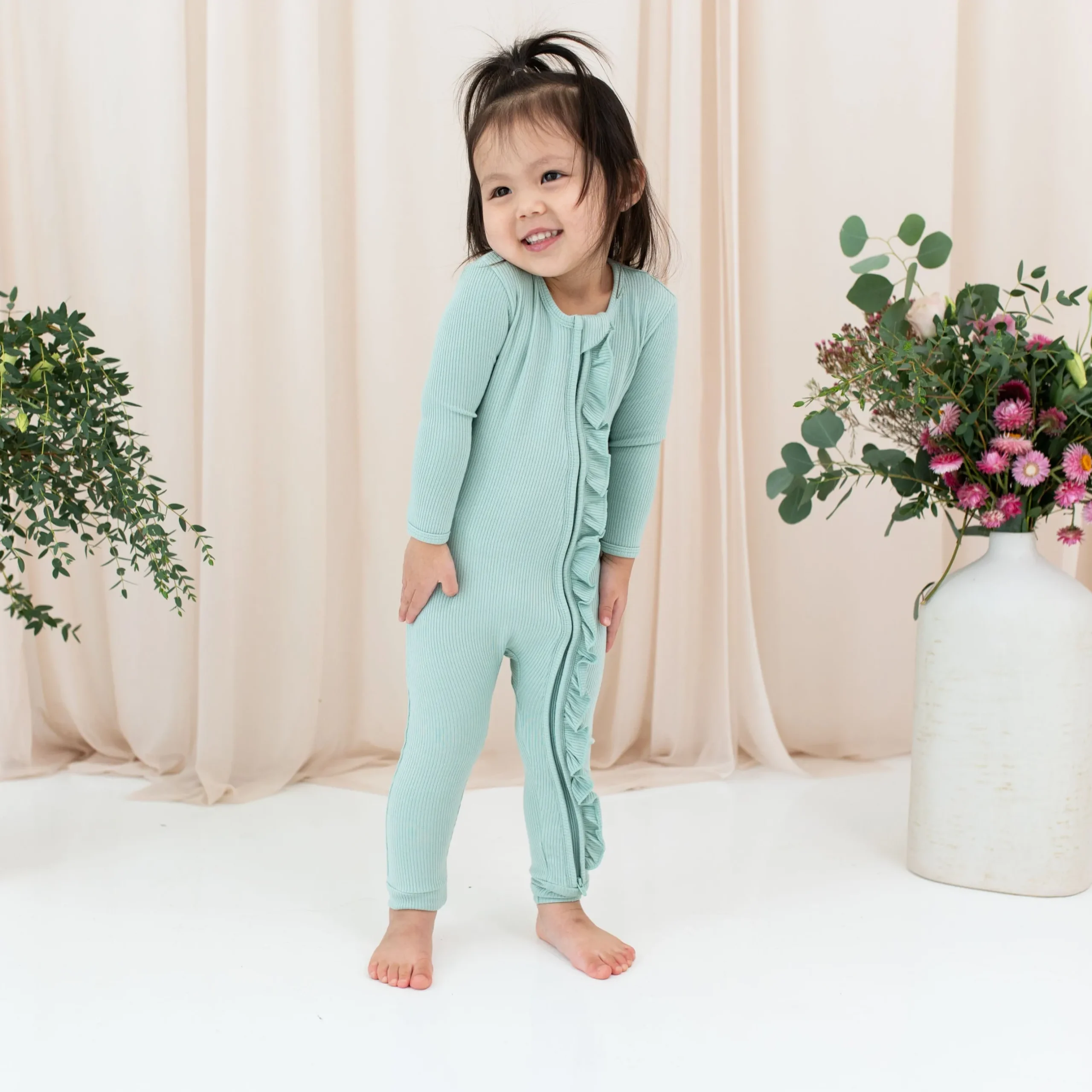 Best Kyte Baby Ribbed Ruffle Zipper Romper in Sage