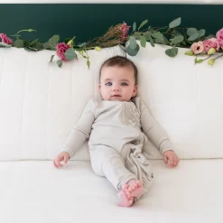 Clearance Kyte Baby Ribbed Ruffle Zipper Romper in Oat