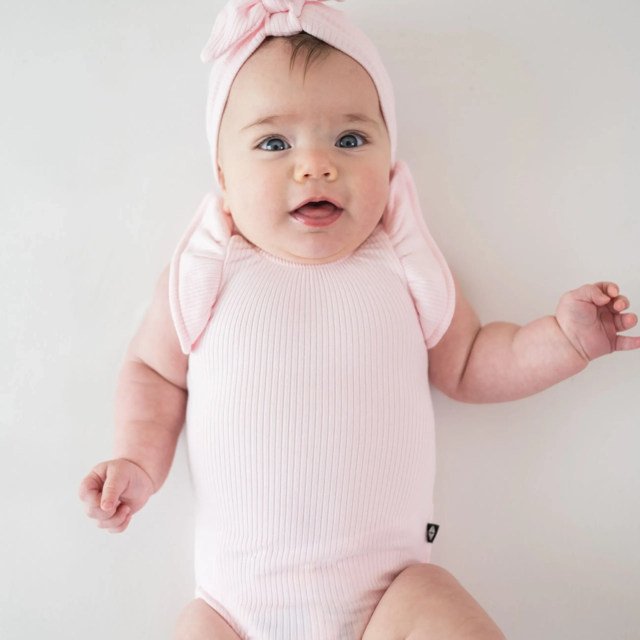 Discount Kyte Baby Ribbed Sleeveless Ruffle Leotard in Sakura