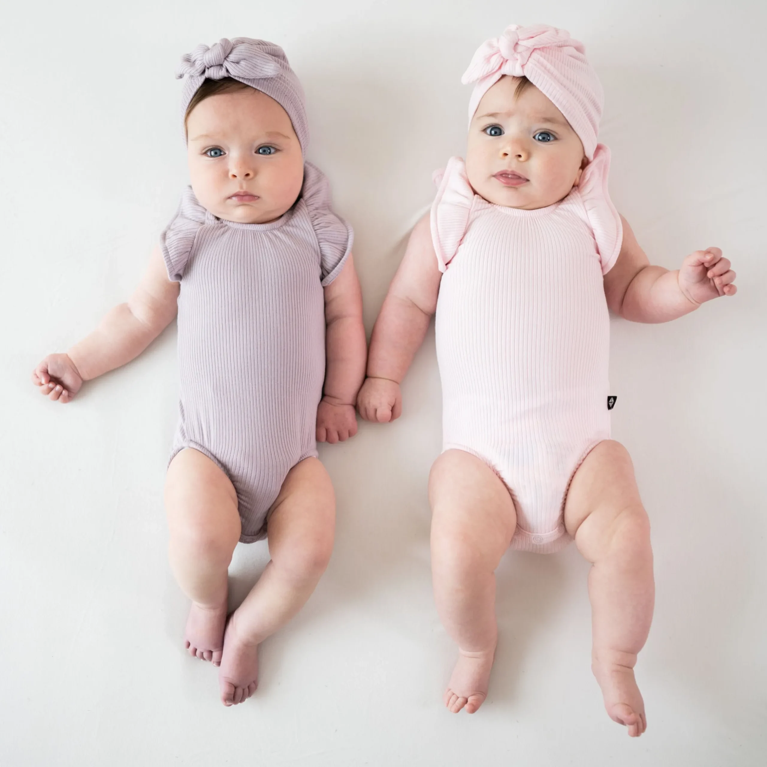Discount Kyte Baby Ribbed Sleeveless Ruffle Leotard in Sakura