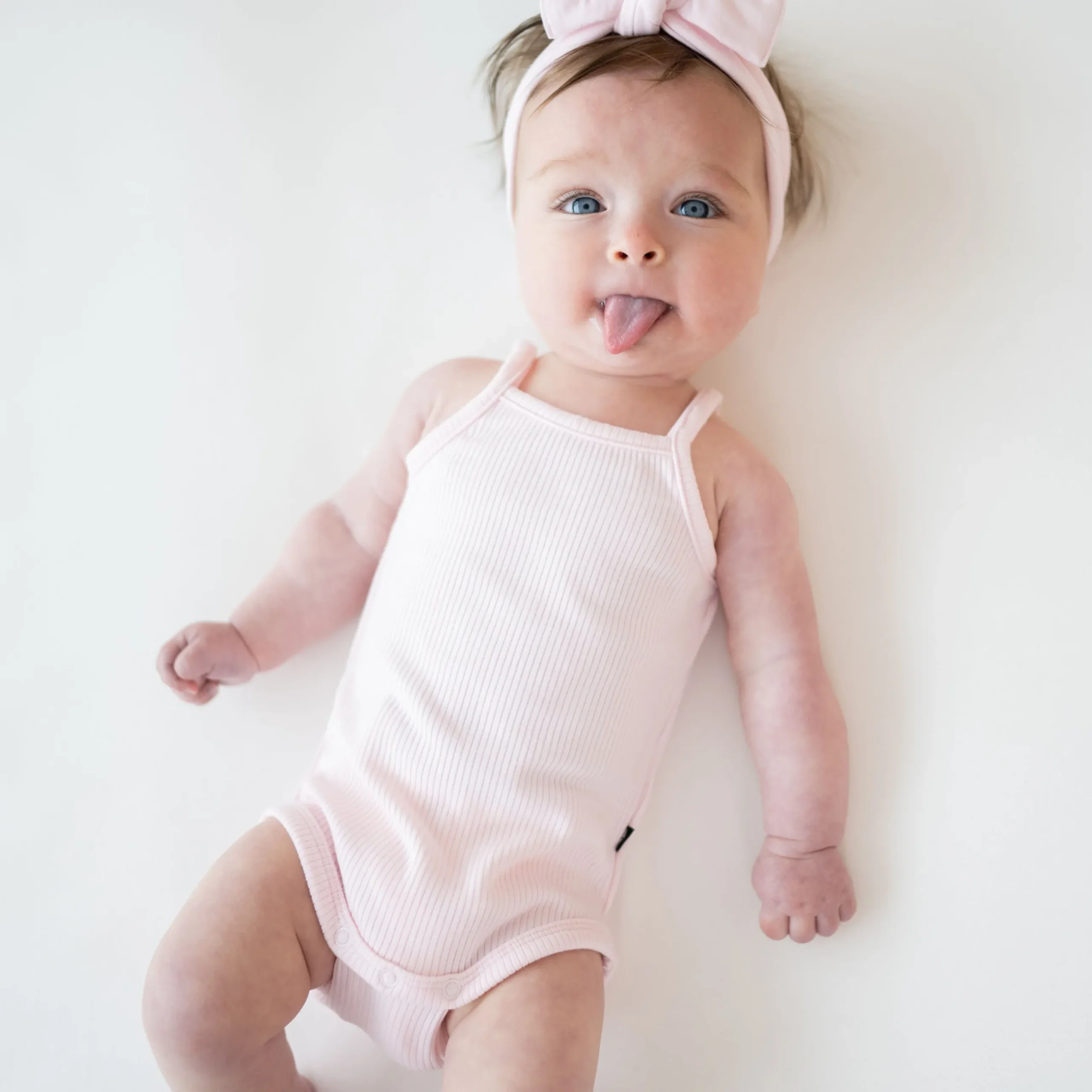 Clearance Kyte Baby Ribbed Spaghetti Strap Bodysuit in Sakura