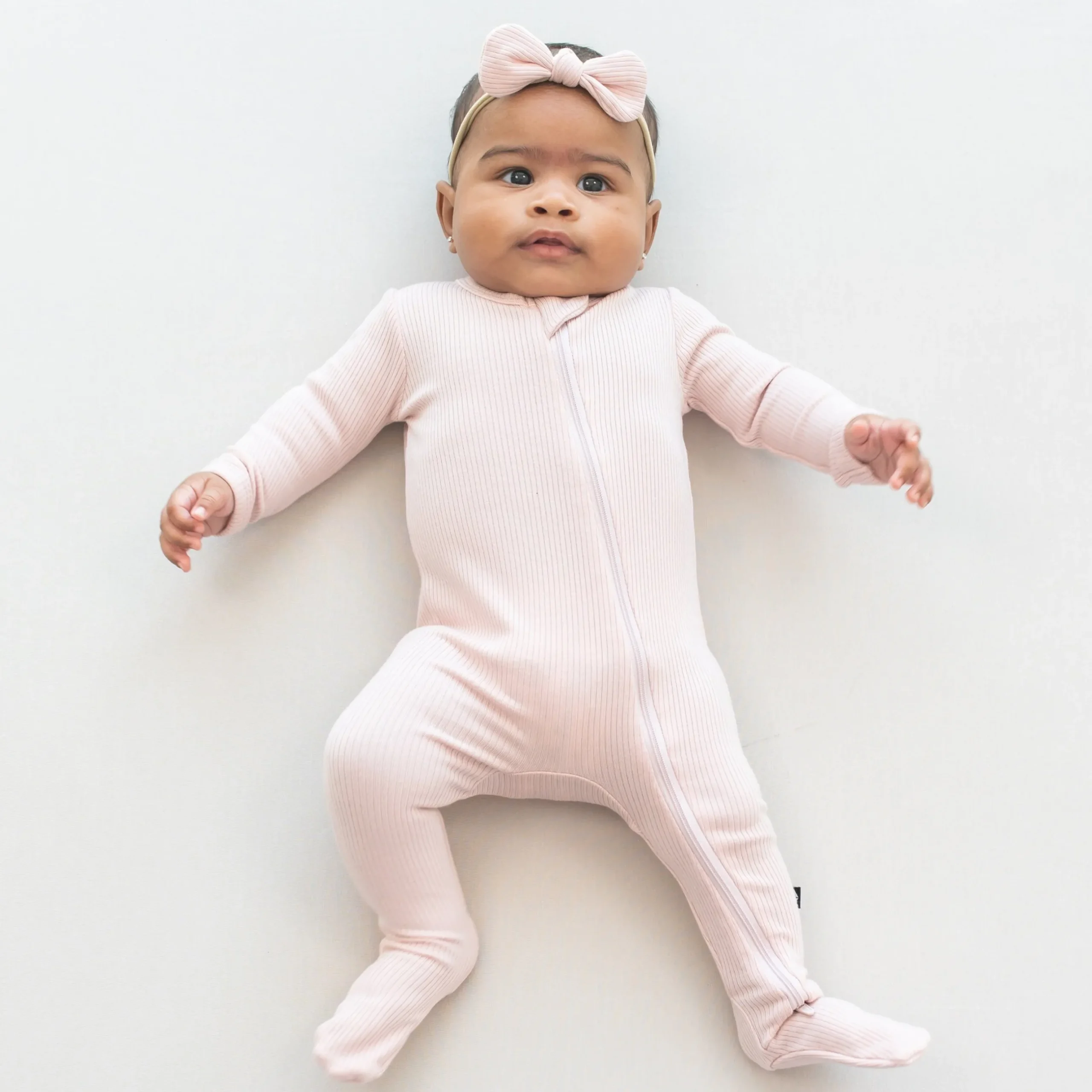 Clearance Kyte Baby Ribbed Zipper Footie in Blush