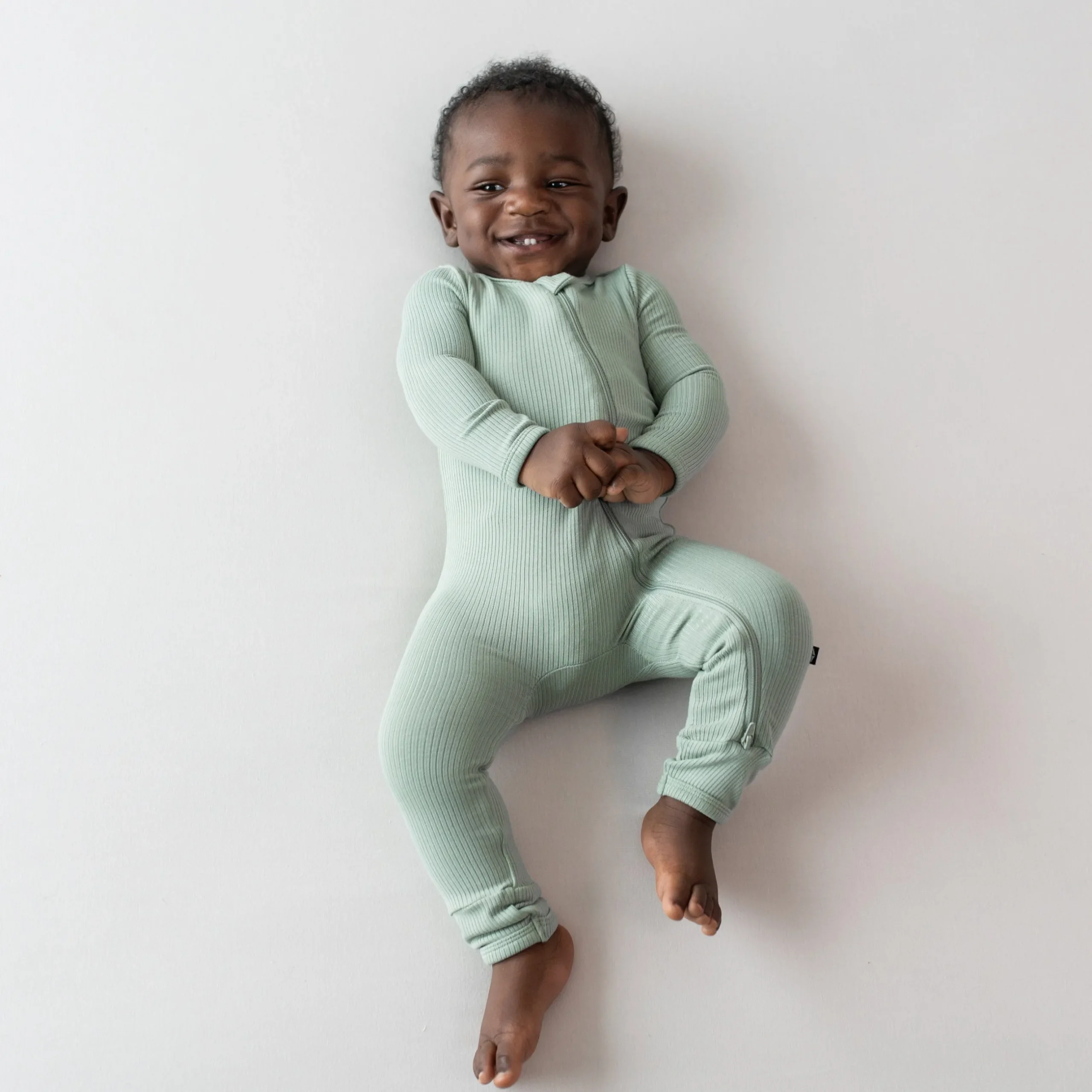 Clearance Kyte Baby Ribbed Zipper Romper in Thyme