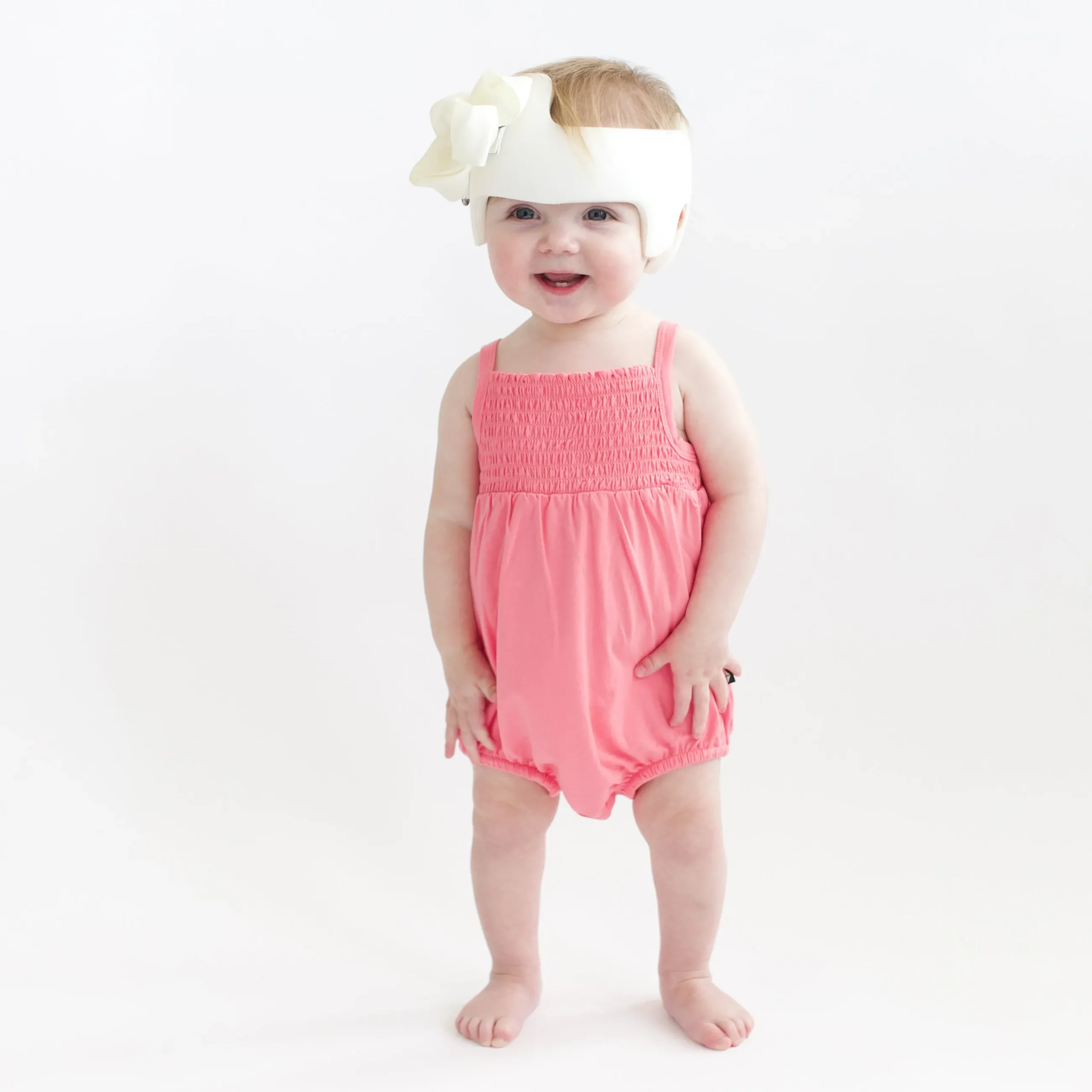 New Kyte Baby Smocked Bubble Romper in Guava
