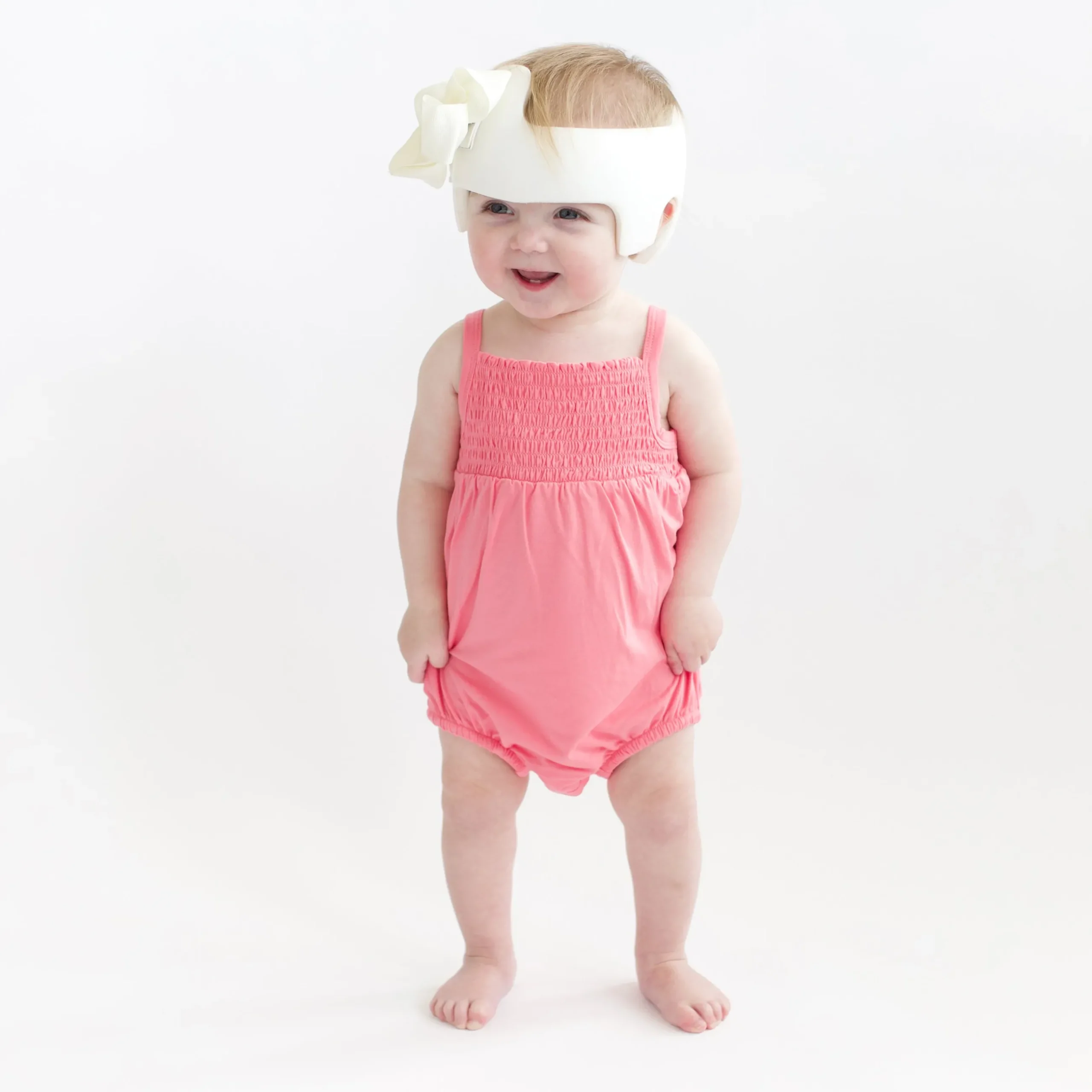 New Kyte Baby Smocked Bubble Romper in Guava