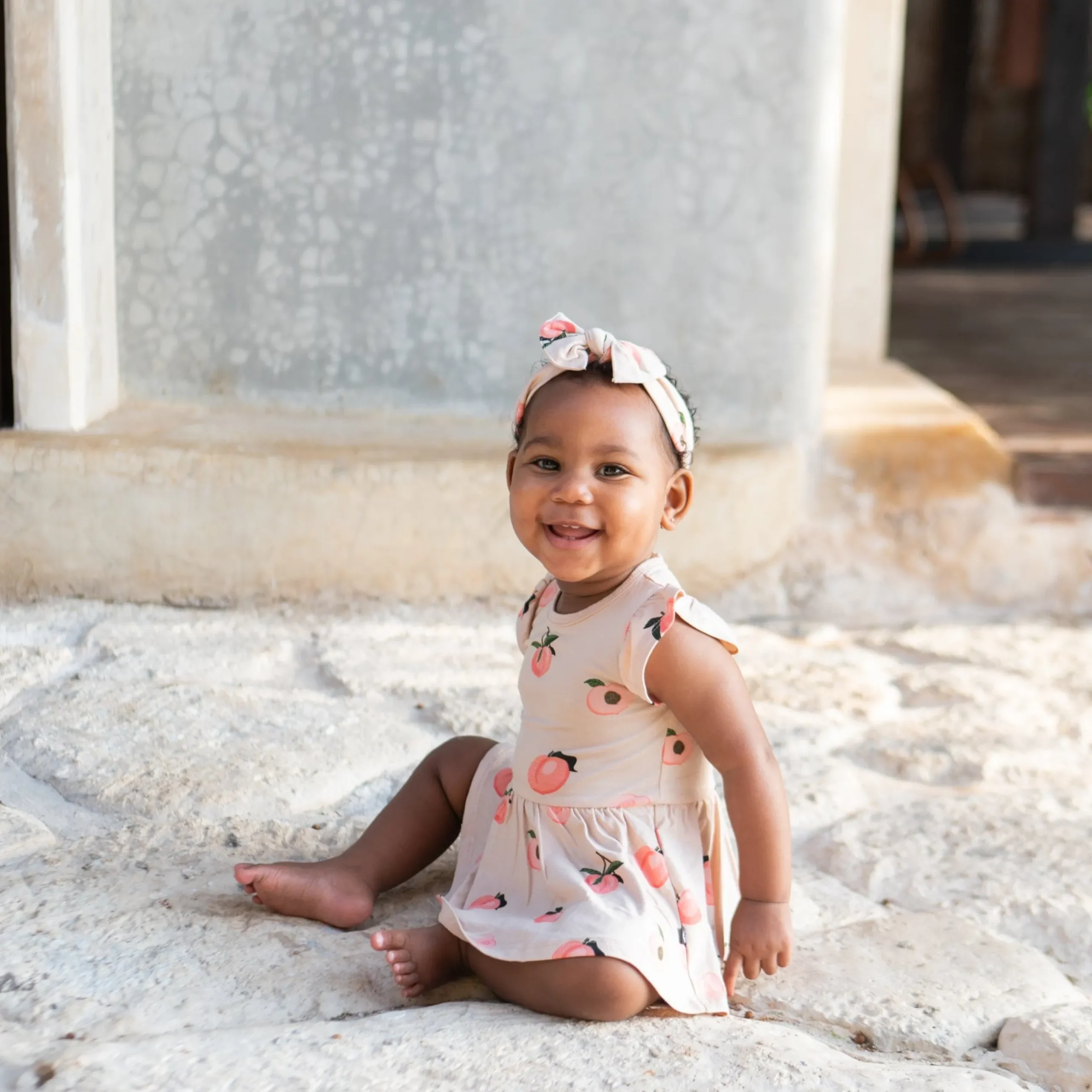 New Kyte Baby Twirl Bodysuit Dress in Peach
