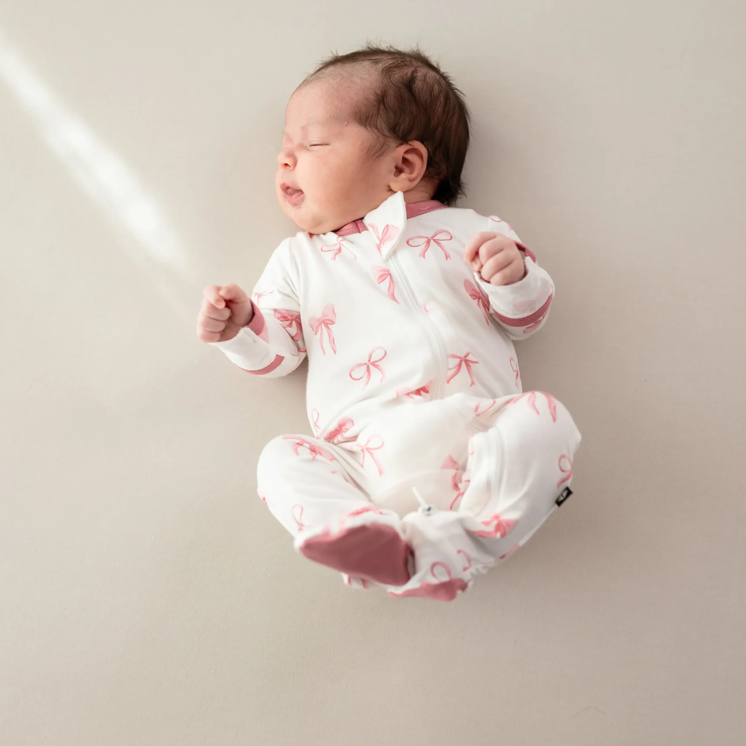Clearance Kyte Baby Zippered Footie in Bow