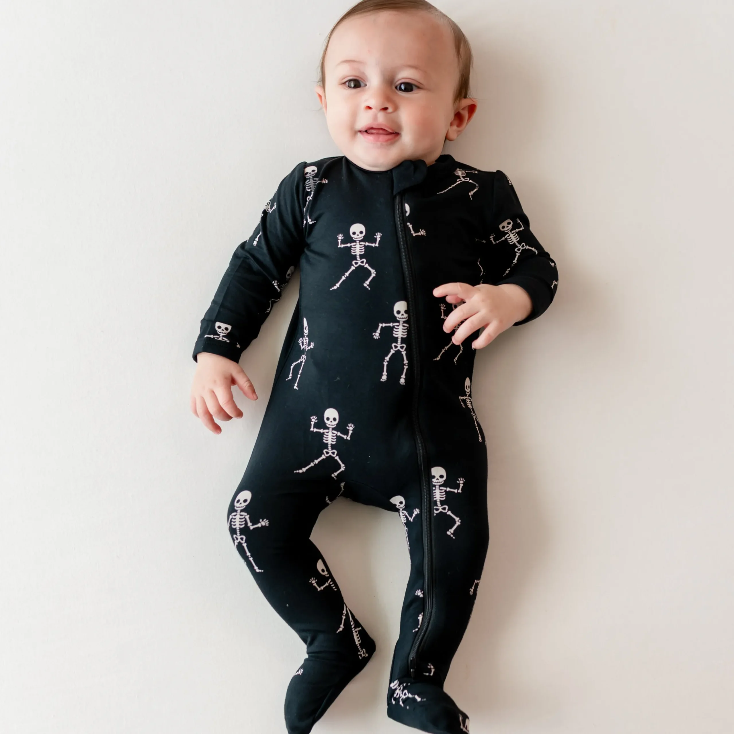 Sale Kyte Baby Zippered Footie in Skeleton