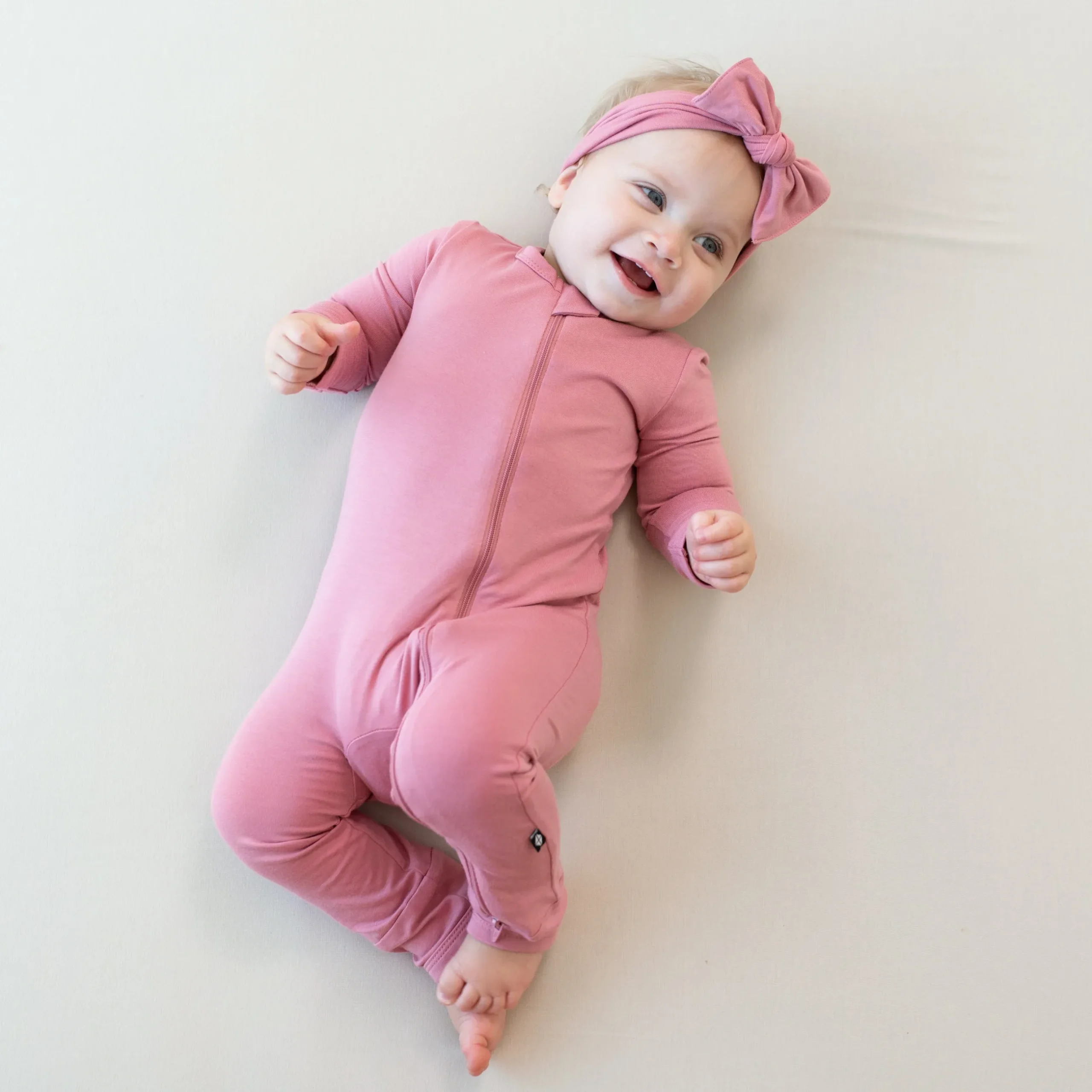 Kyte Baby Zippered Romper in Apple Blossom