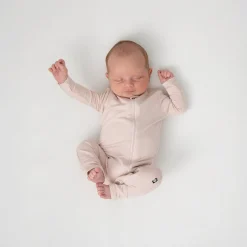 Online Kyte Baby Zippered Romper in Blush