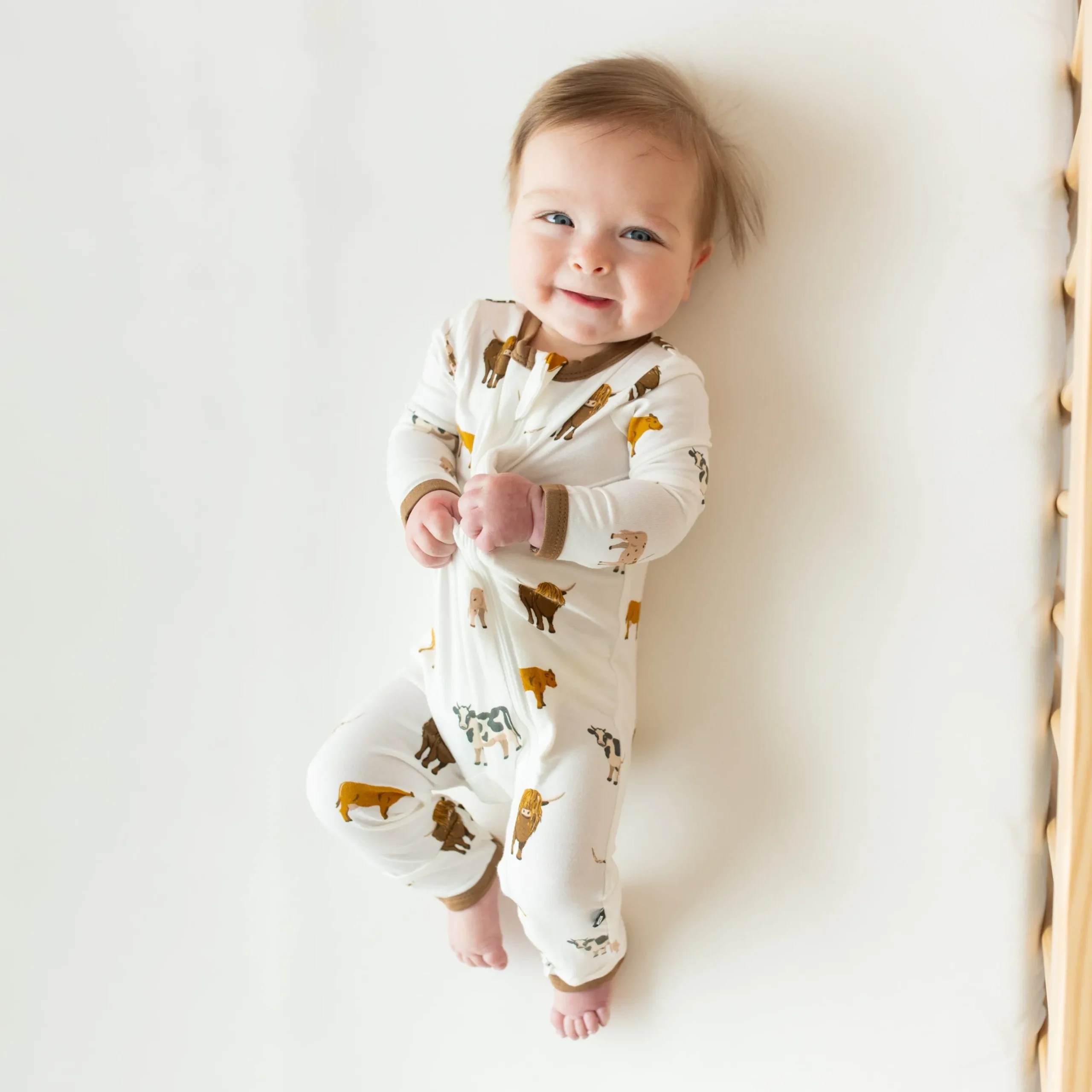 Kyte Baby Zippered Romper in Moo