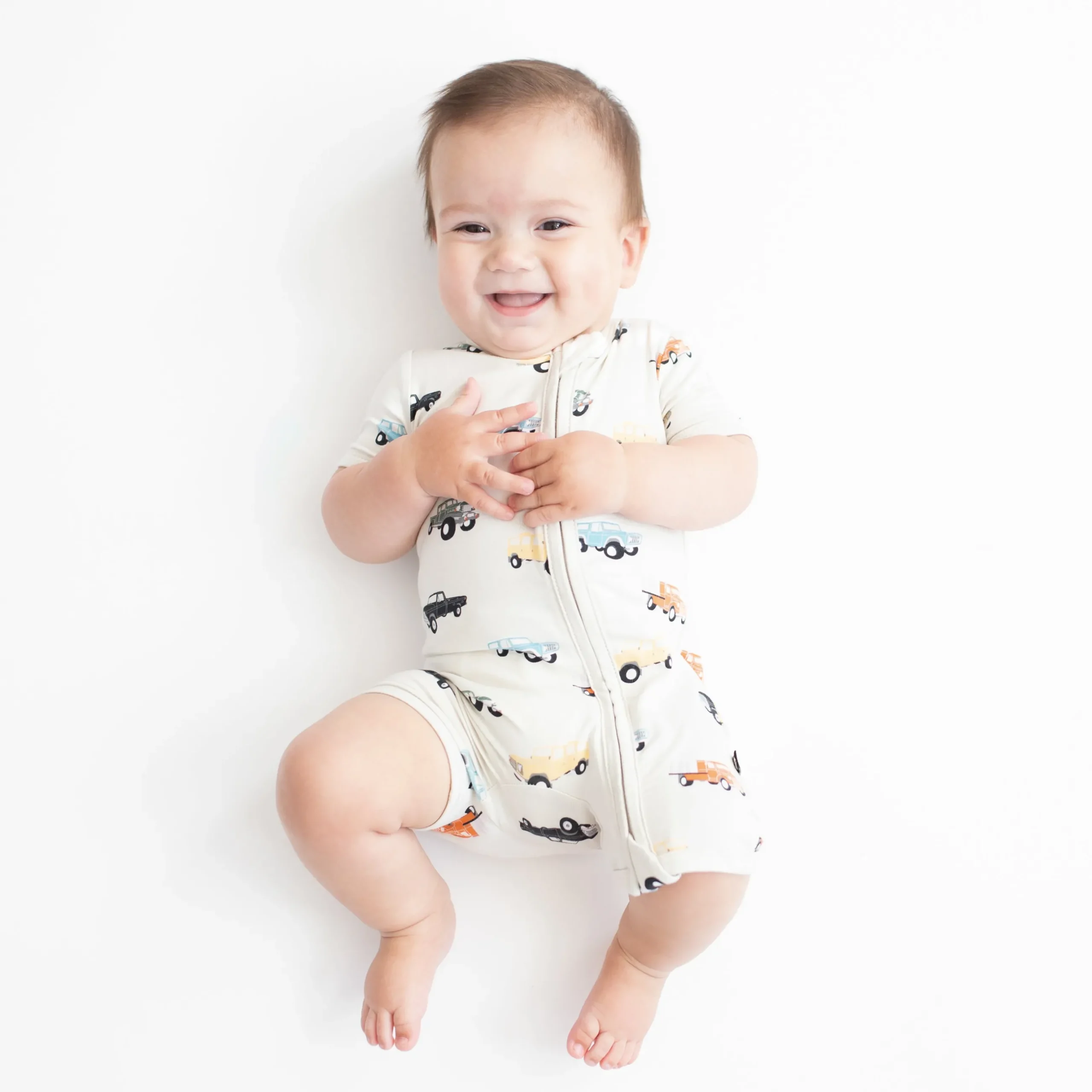Kyte Baby Zippered Shortall Romper in Vintage Truck