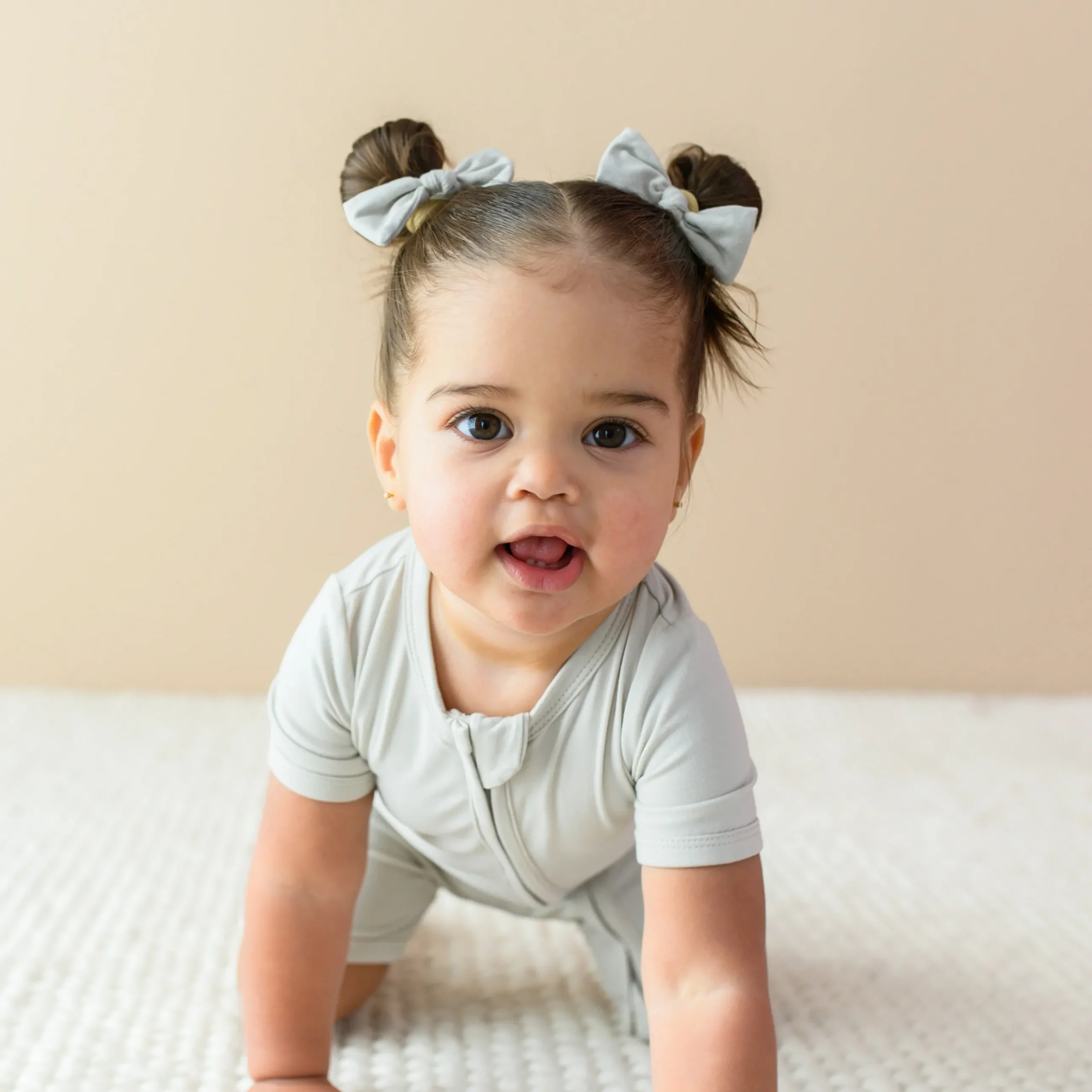 New Kyte Baby Zippered Shortall Romper in Oat