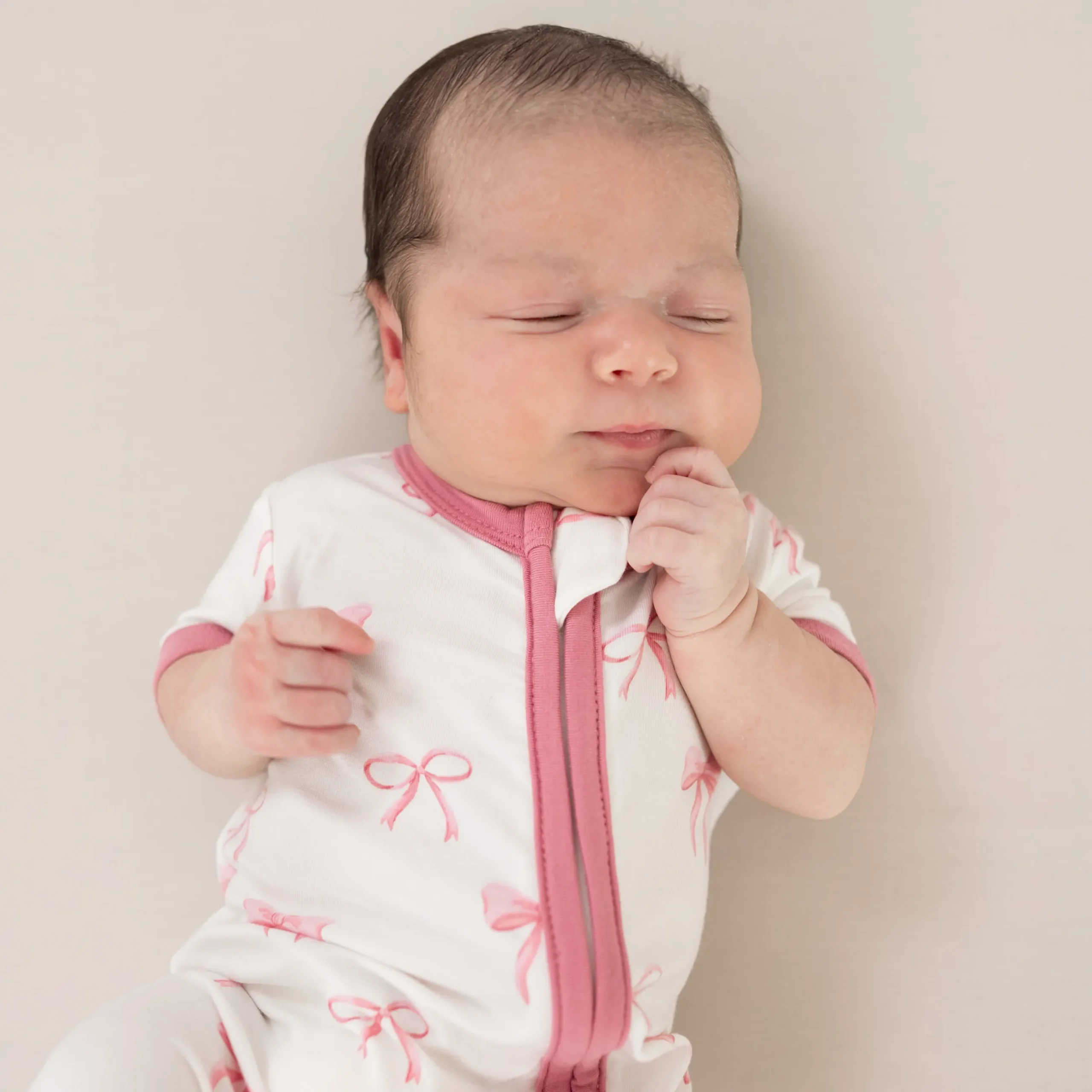 Sale Kyte Baby Zippered Shortall Romper in Bow