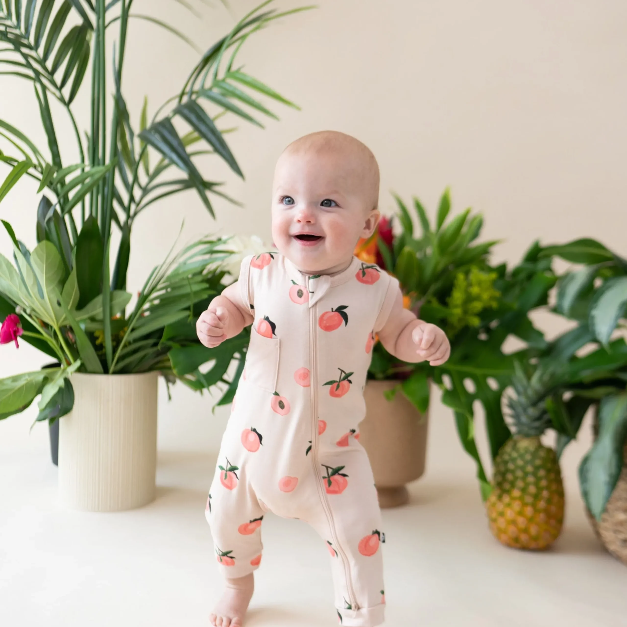 New Kyte Baby Zippered Sleeveless Romper in Peach