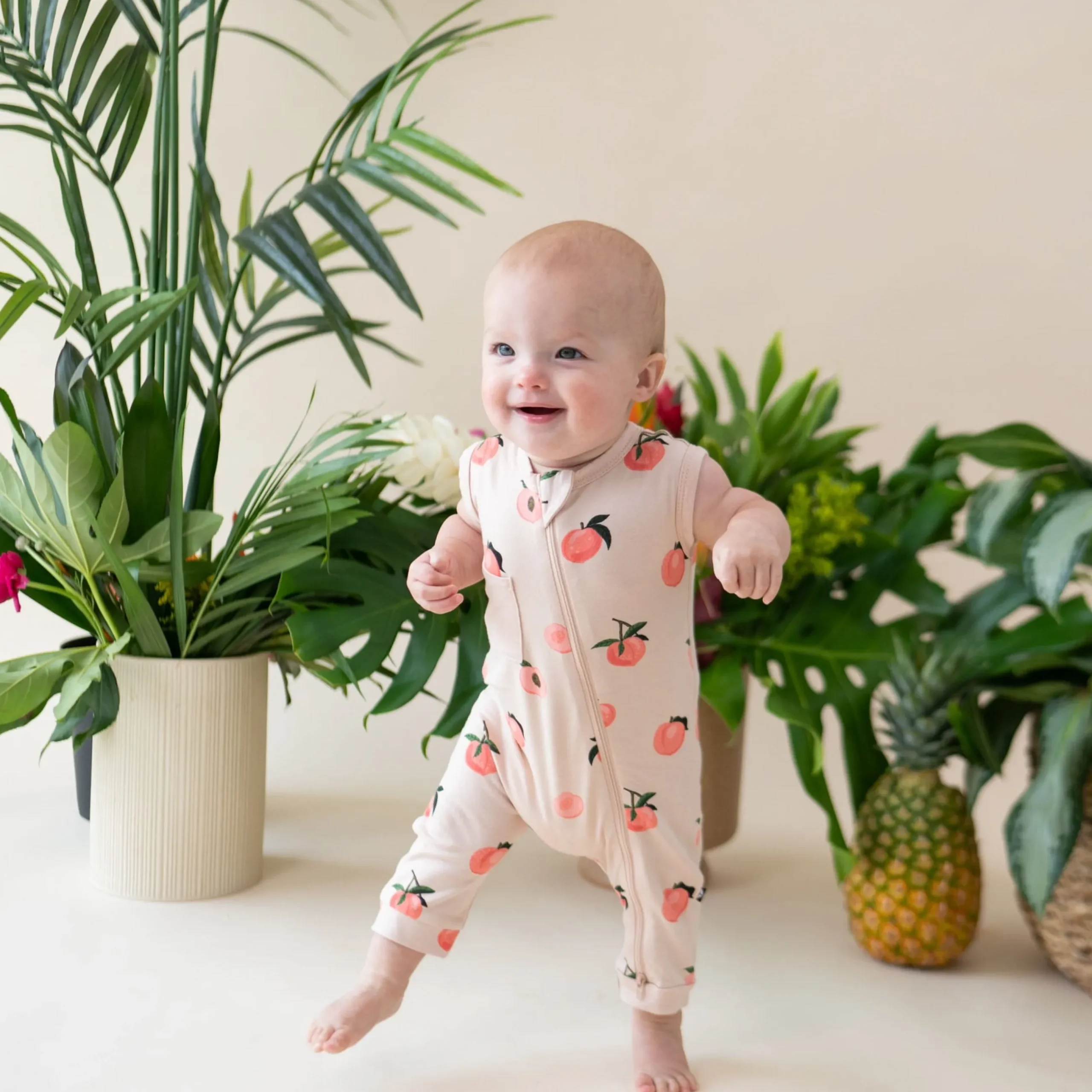 New Kyte Baby Zippered Sleeveless Romper in Peach